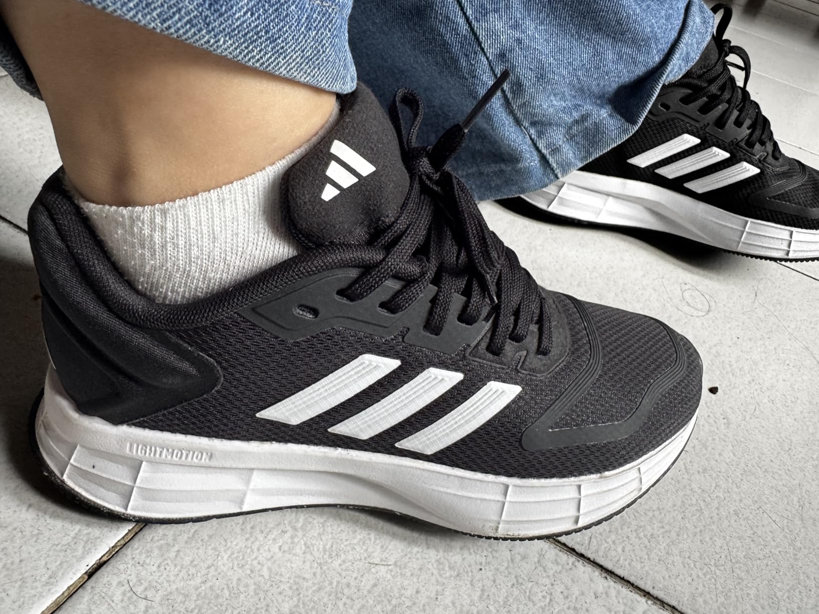 Adidas Duramo SL 2.0 outsole showing rubber traction pattern and wear-resistant design for multiple surfaces