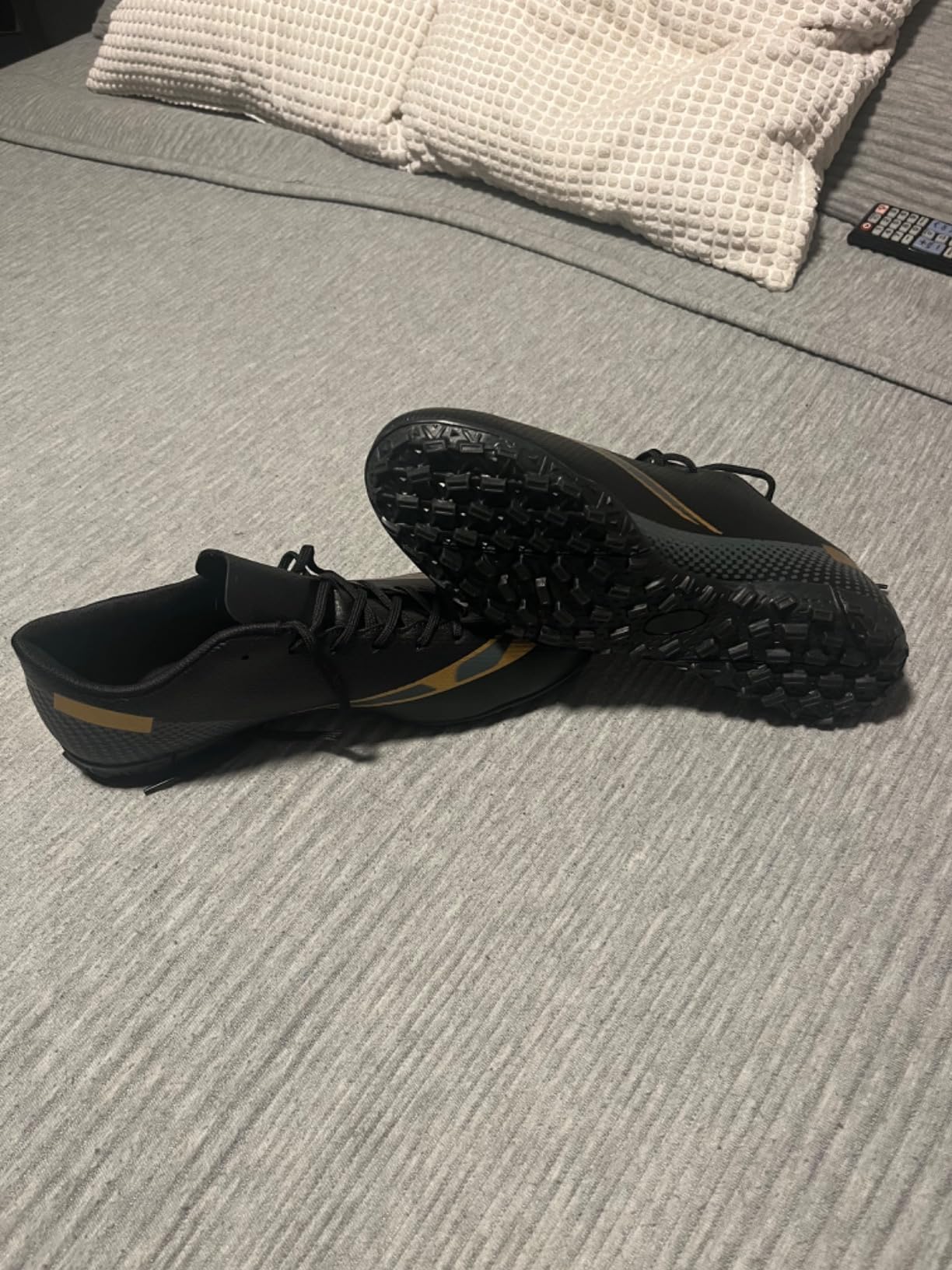 Close-up view of HaloTeam soccer cleats showing synthetic leather upper construction and lacing system