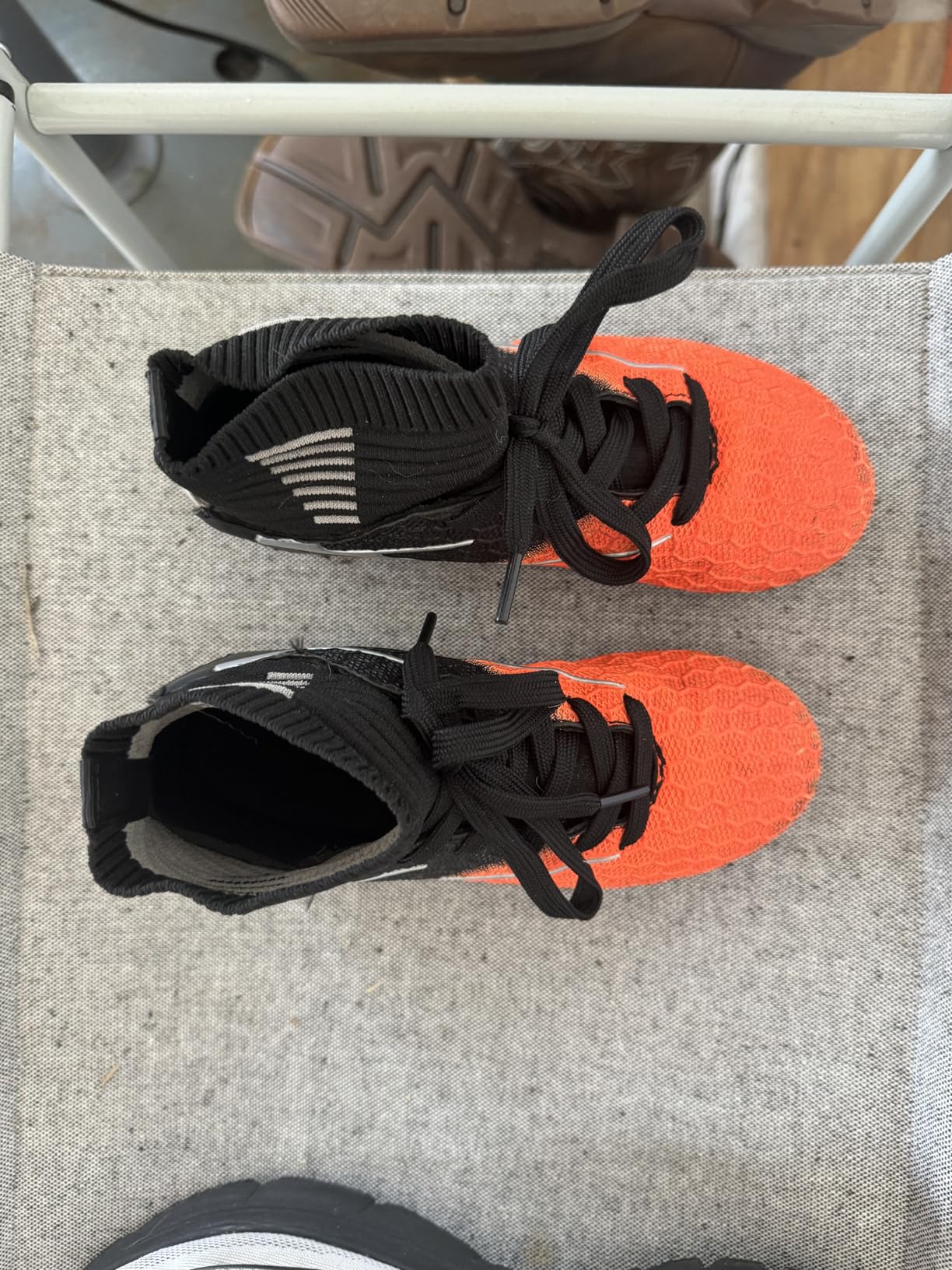 DREAM PAIRS soccer cleats showing detailed view of high-top ankle support and textured upper material