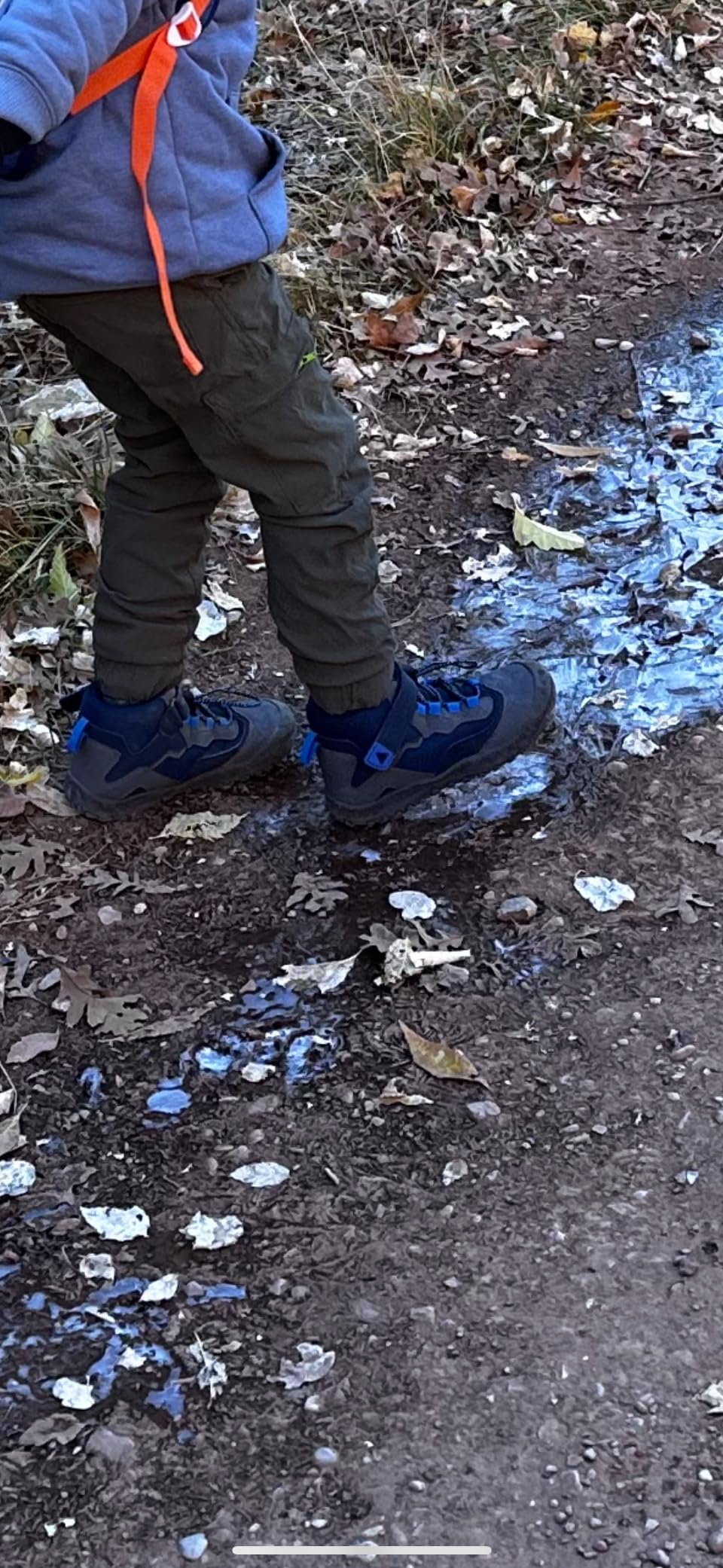 Mishansha kids hiking boots in action on outdoor terrain showing water resistant performance and grip capabilities