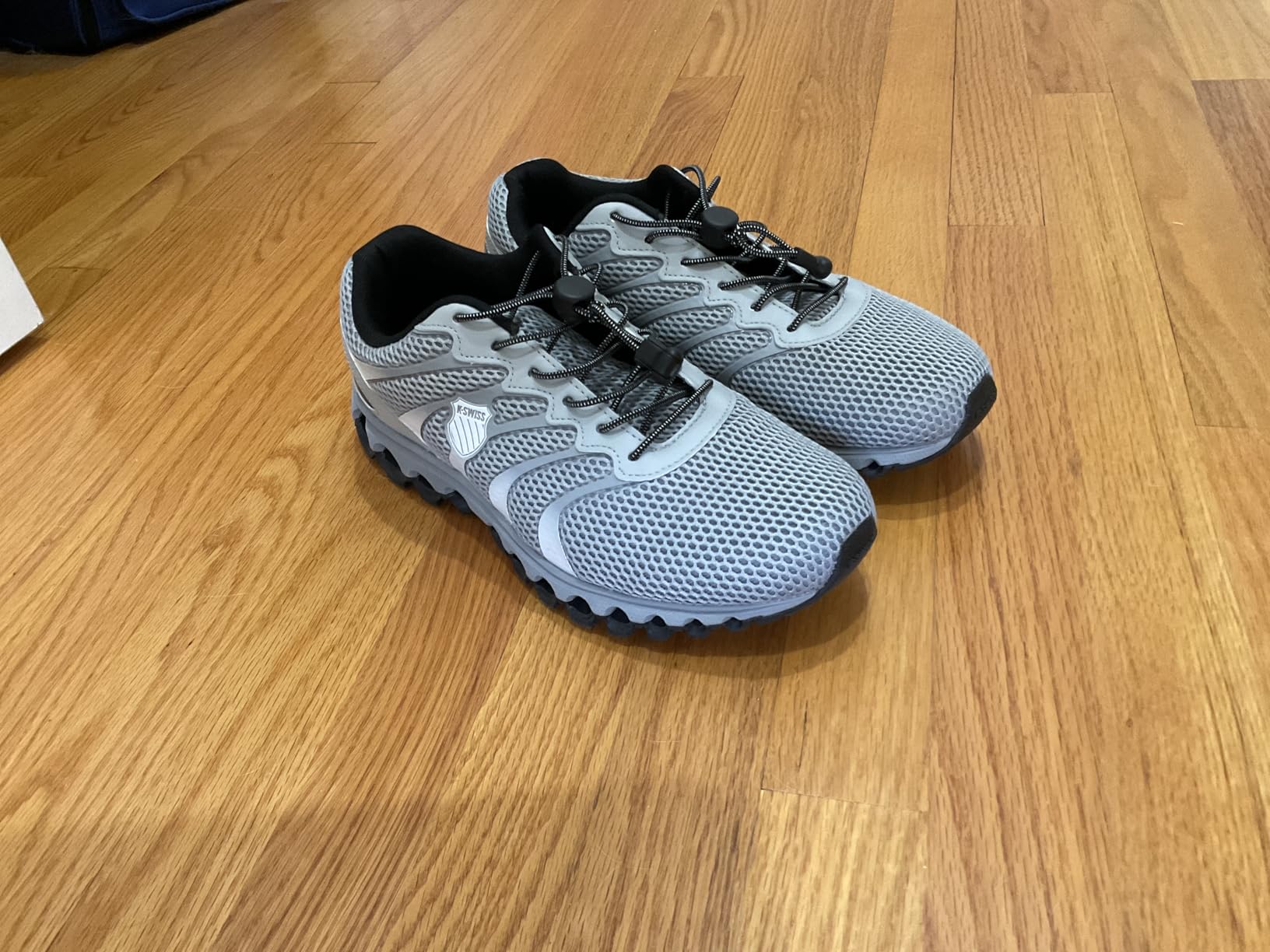 Close-up view of K-Swiss Tubes 200 showing detailed mesh upper construction and lacing system