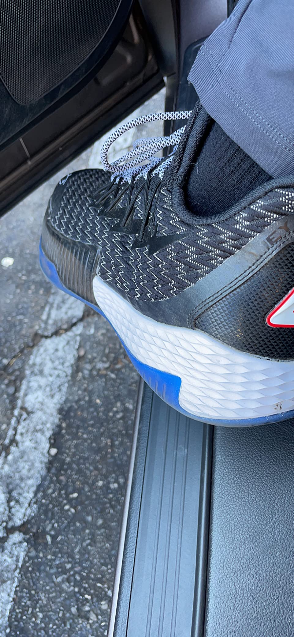 PEAK Lou Williams Lightning basketball shoes white and dark blue colorway on court surface