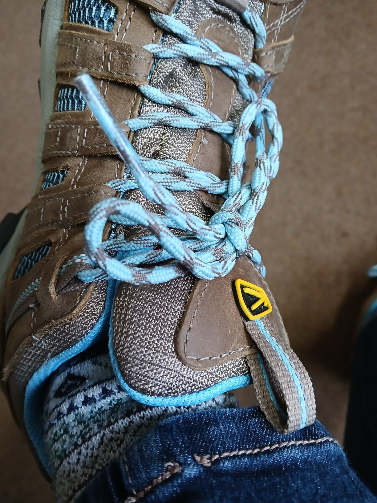 KEEN Voyageur hiking shoe showing water resistant leather upper and performance mesh breathability panels