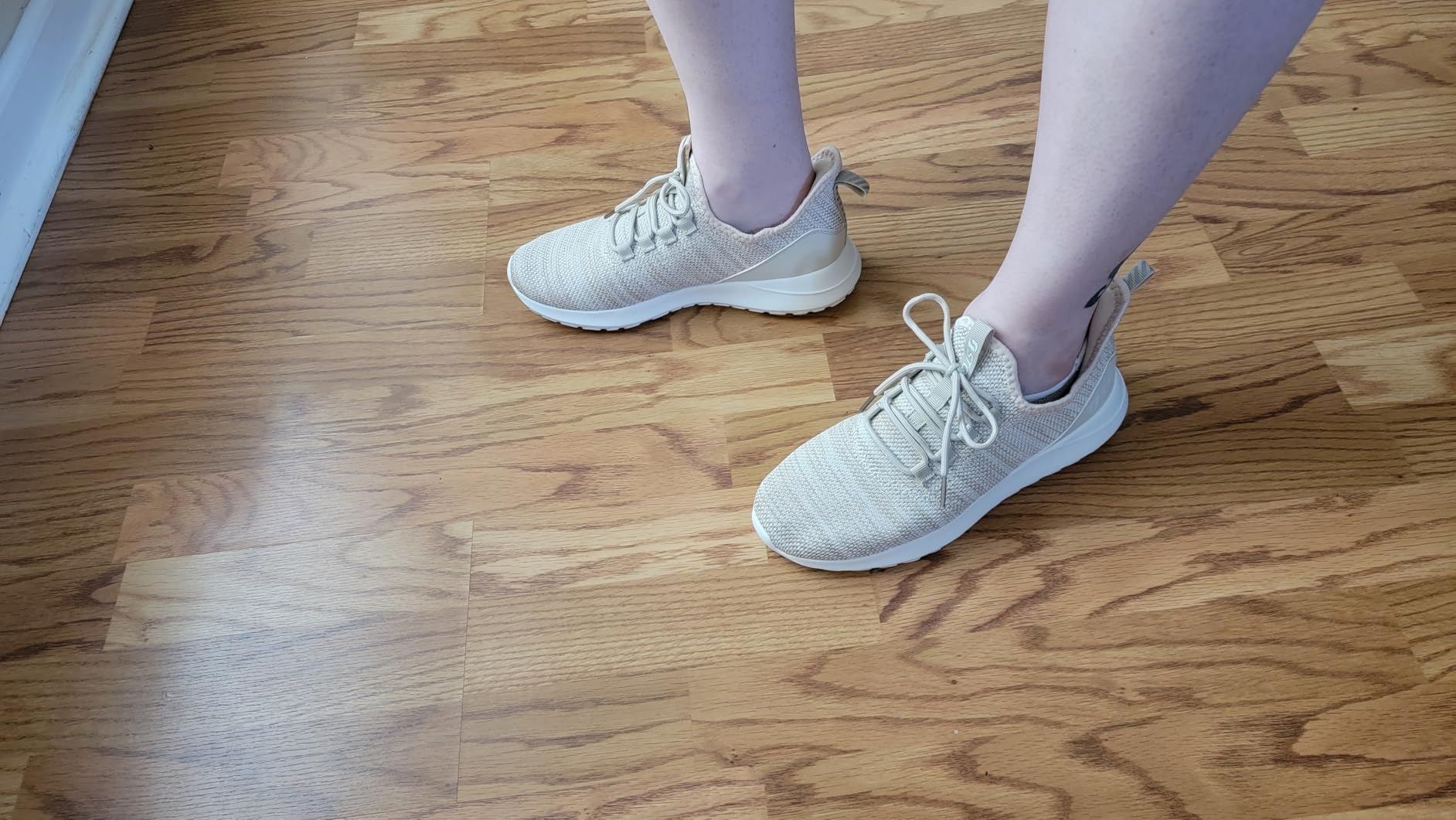 STQ women's sneakers side profile showing heel design and slip-on mechanism