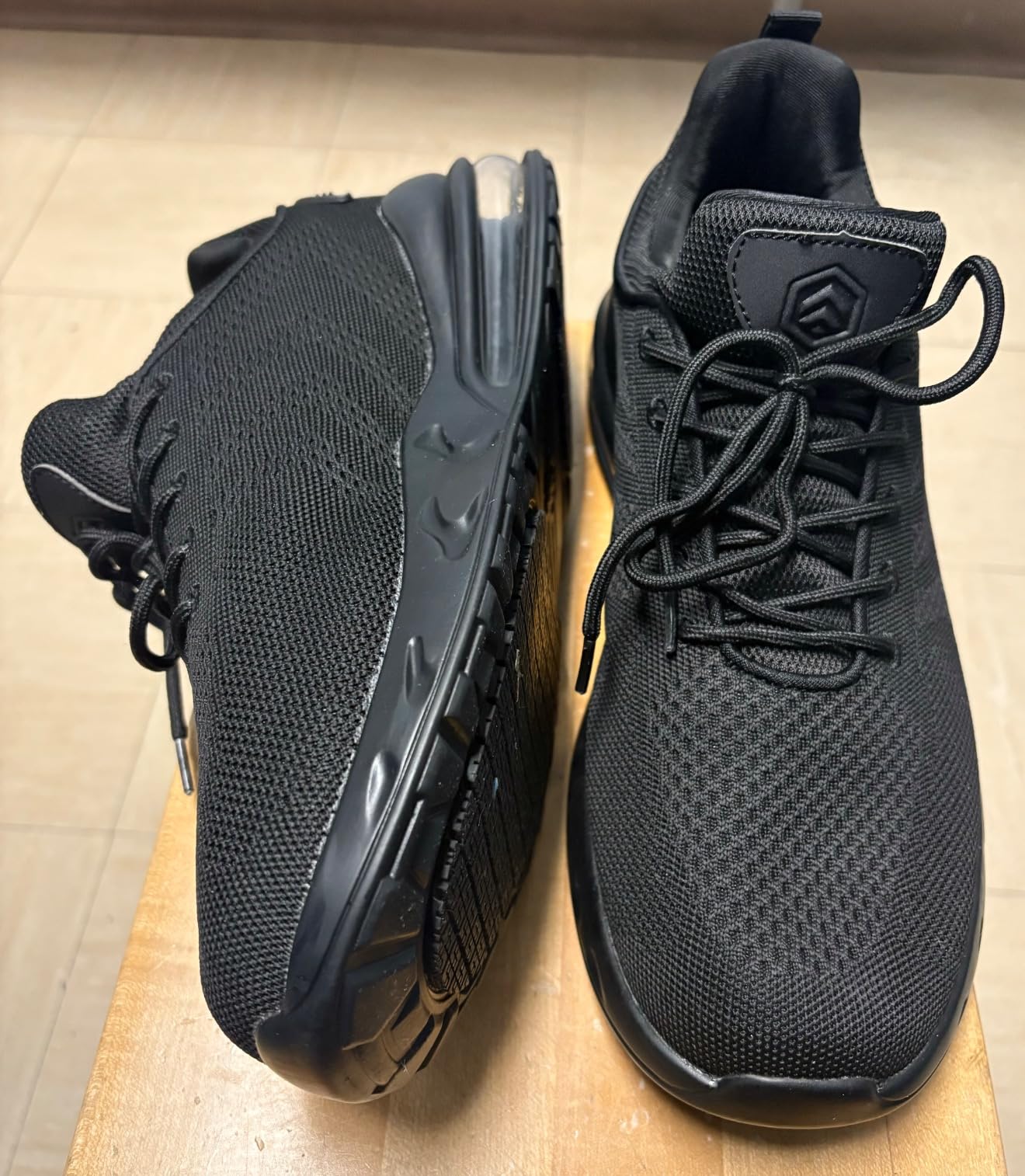 Comparison image showing LARNMERN work shoes against marketing claims