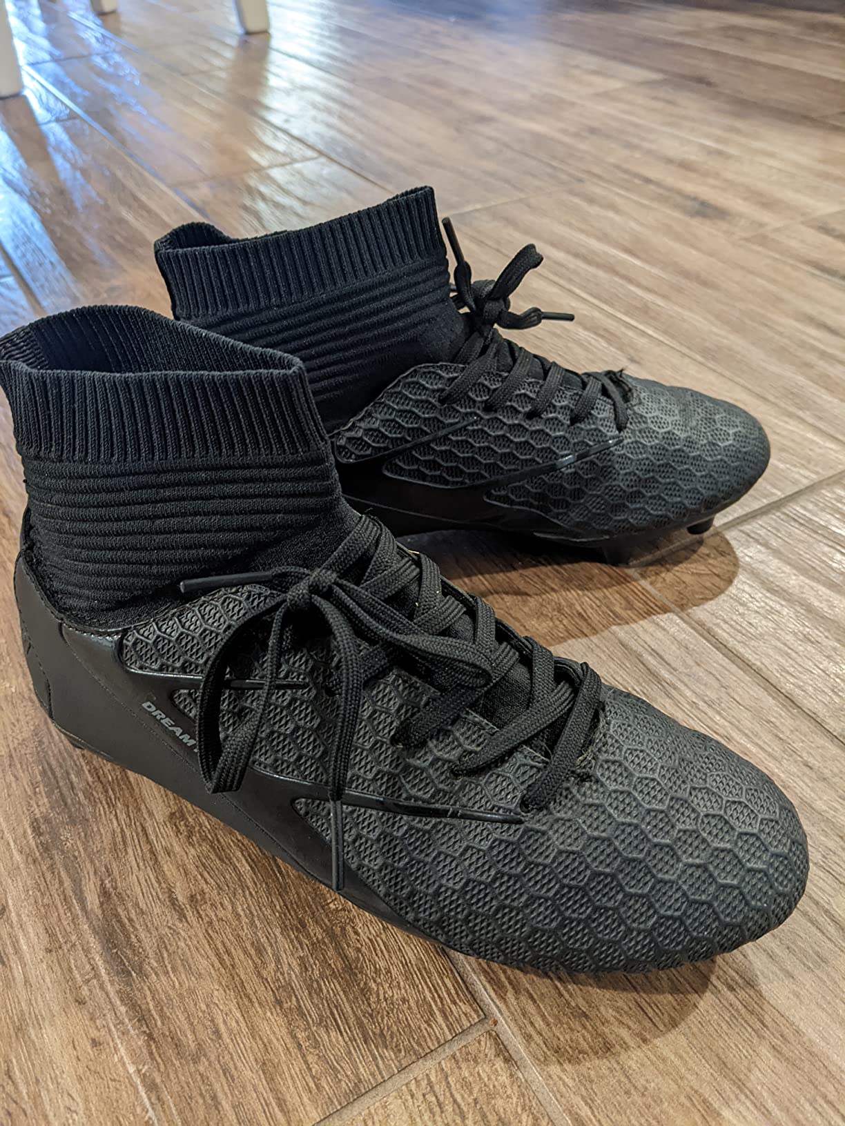 Final assessment view of DREAM PAIRS Boys Girls Soccer Cleats showing overall design and construction