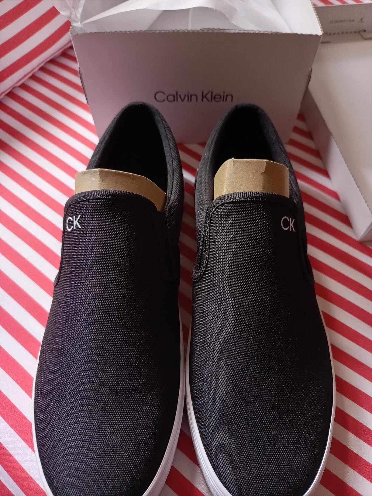 Calvin Klein Ryor sneaker showing canvas upper construction and slip-on design