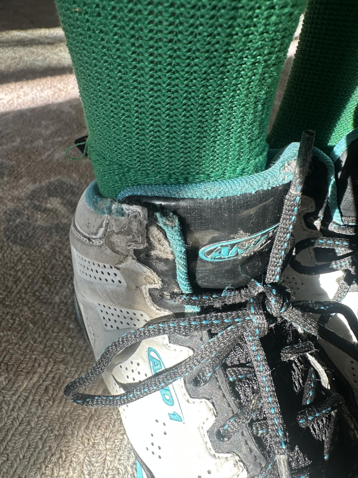 Close up view of AND1 Showout high top basketball shoes showing synthetic upper construction and lacing system