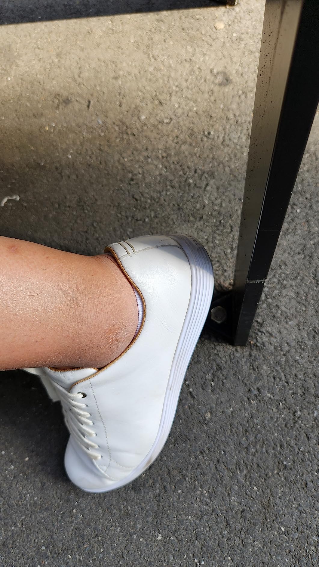 Worn Cole Haan sneakers showing real-world usage and slight wear patterns after extended testing