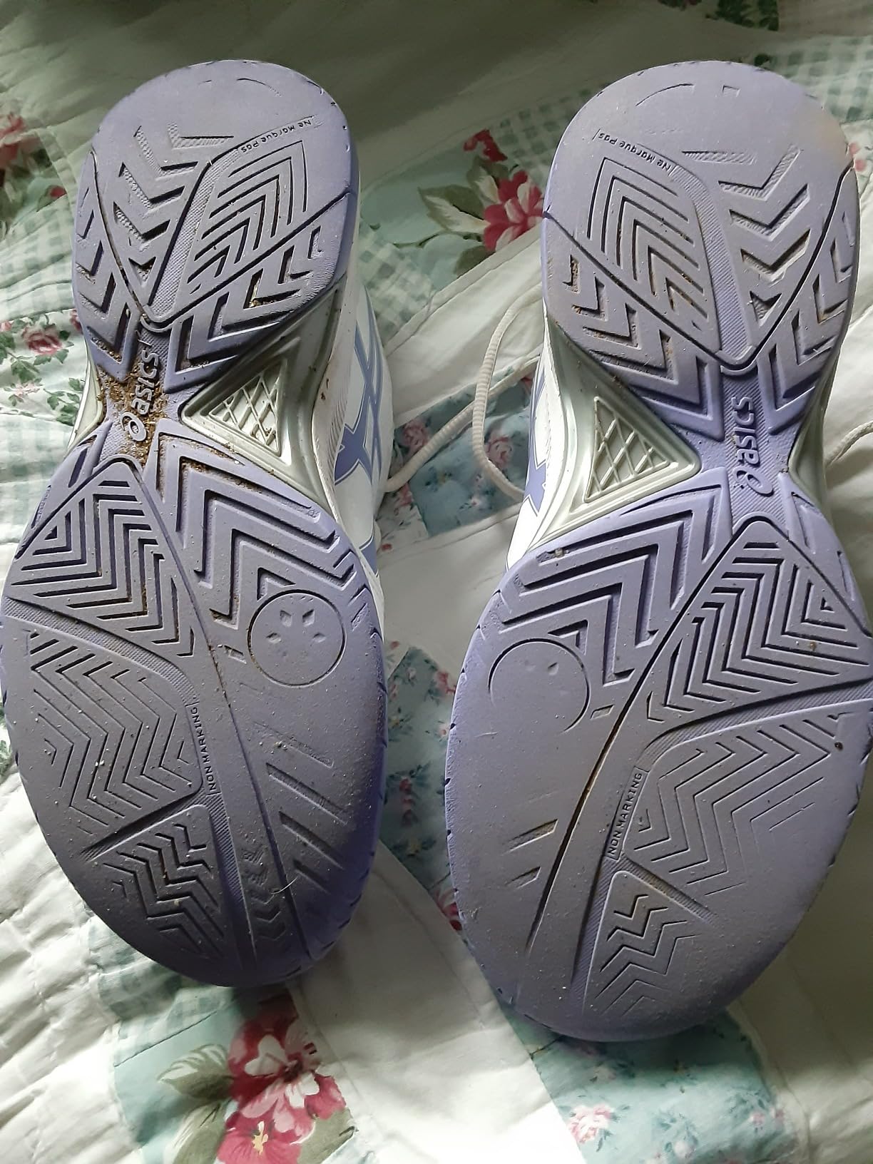 ASICS Gel-Dedicate 7 side profile showing synthetic leather upper construction and court outsole pattern