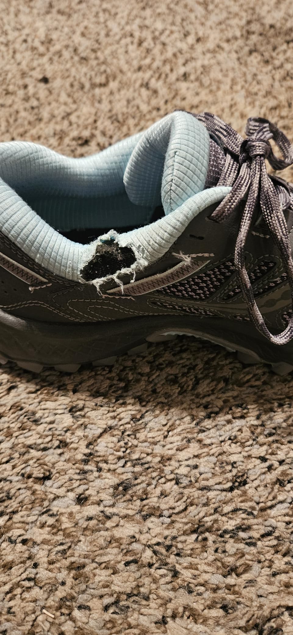 Multiple customer photos showing durability issues with Saucony TR13 trail shoes