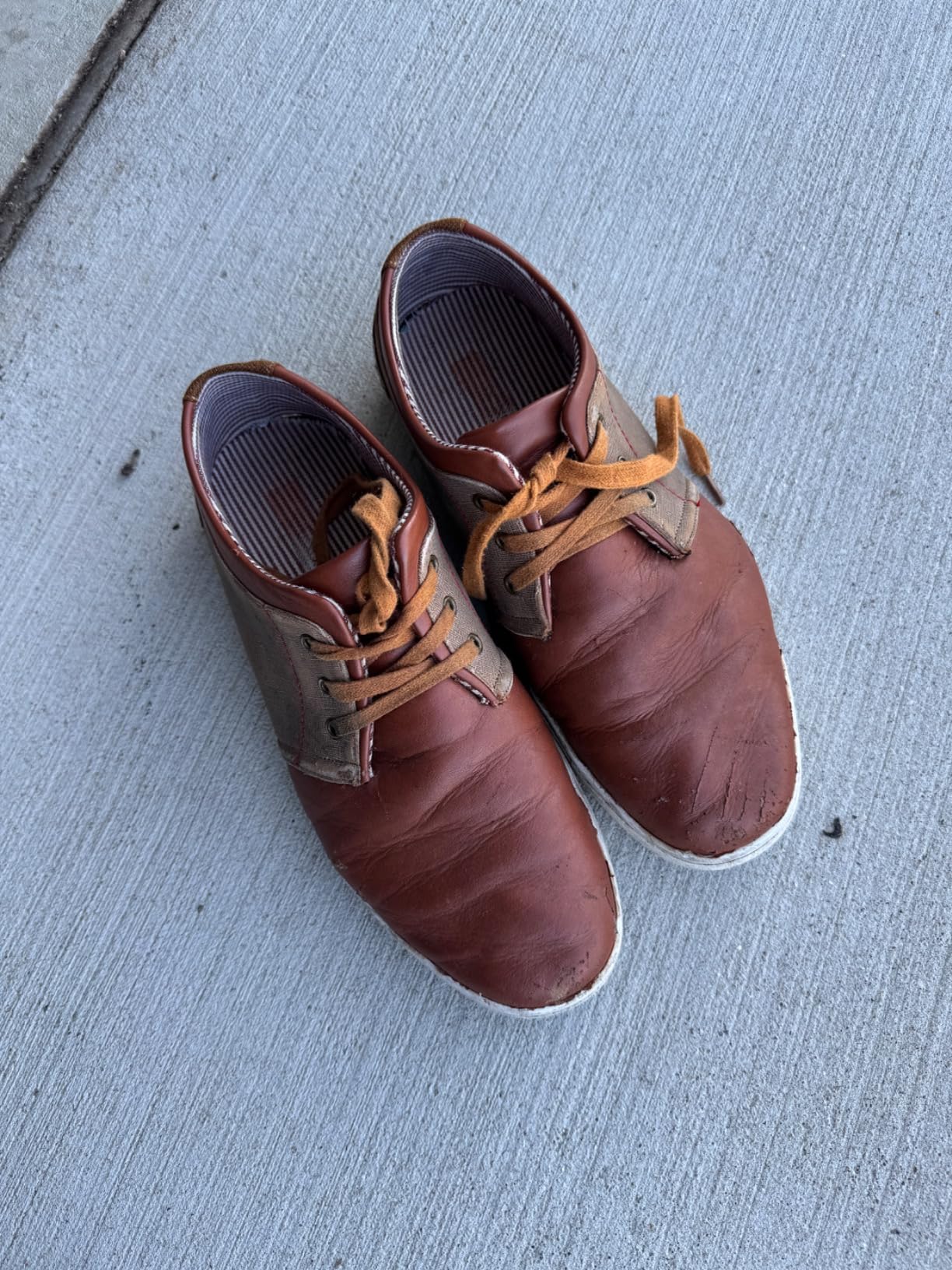 Bruno Marc sneakers detail shot showing PU leather upper construction and lace-up closure system