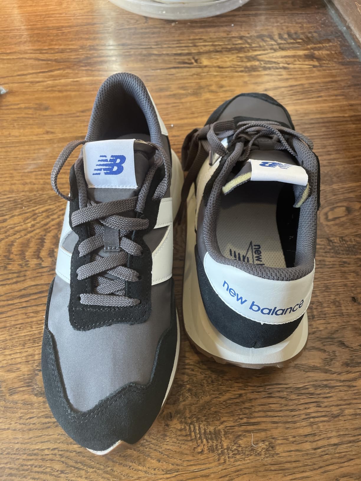 Comparison showing New Balance 237 quality control issues with mismatched labeling