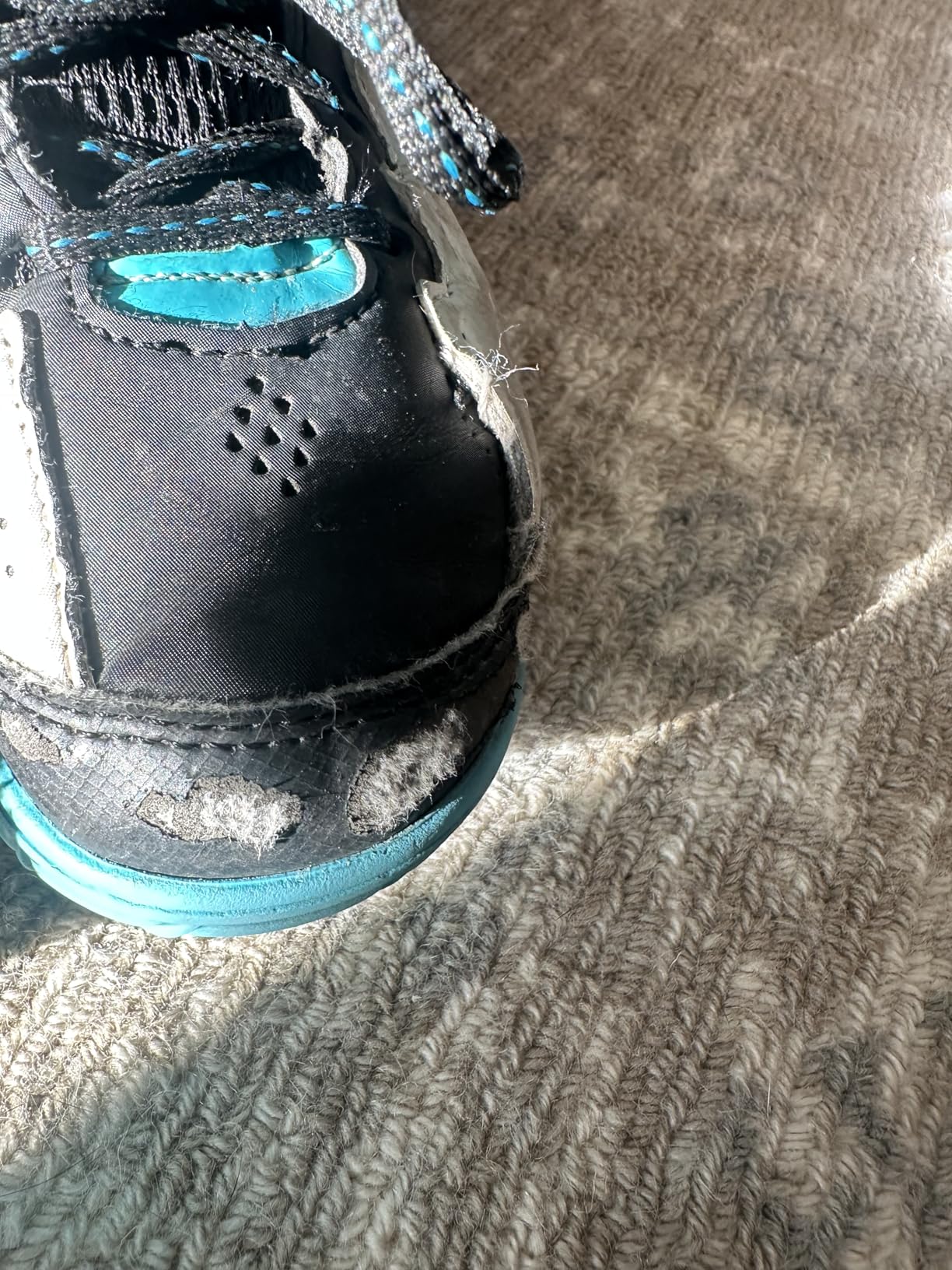 Side profile of AND1 Showout showing high ankle support design and heel pull tab for easy on-off