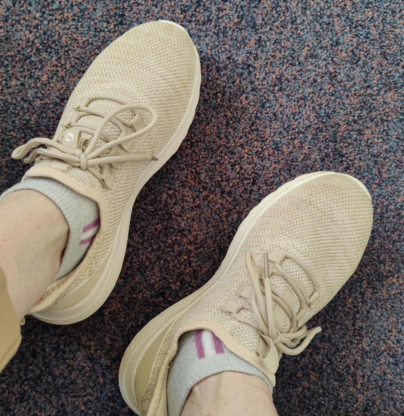 STQ women's sneakers during walking activity showing sole traction and flexibility