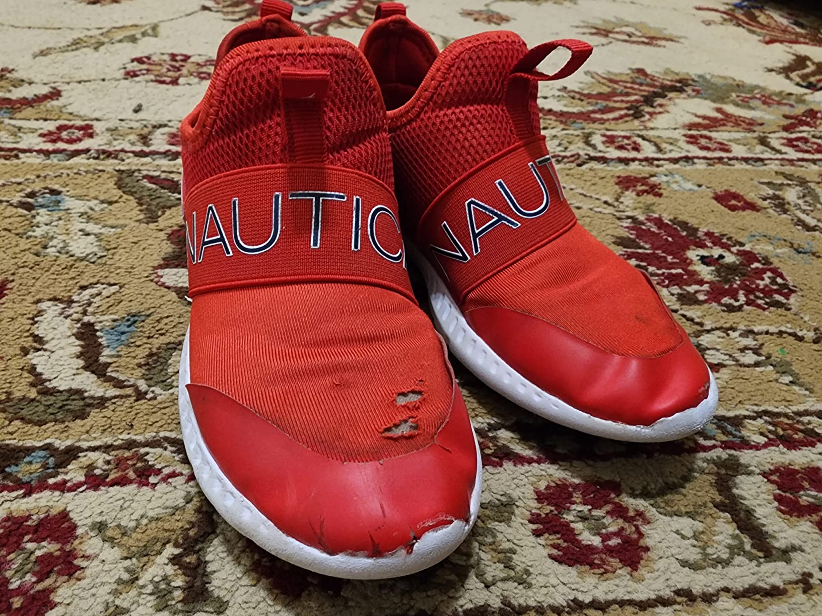 Multiple Nautica boys sneakers showing wear patterns from real-world testing