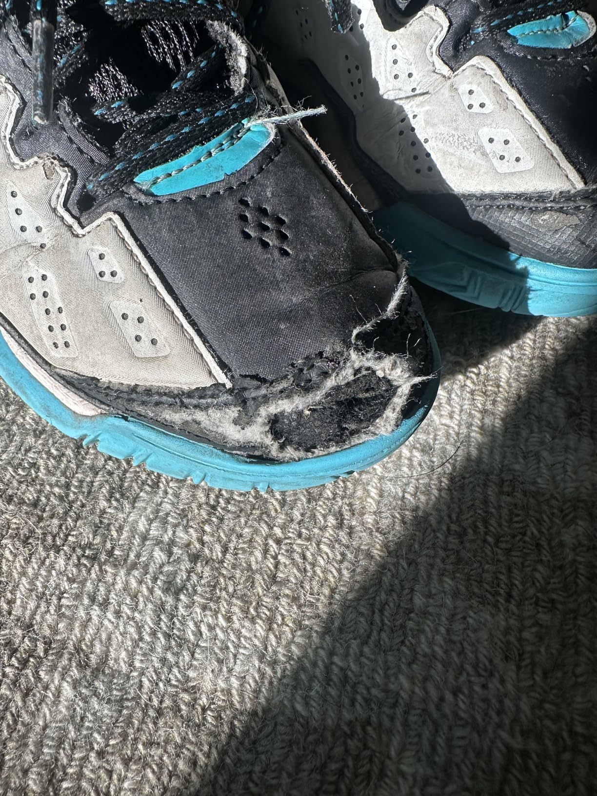 Bottom view of AND1 Showout basketball shoes showing herringbone traction pattern and rubber outsole