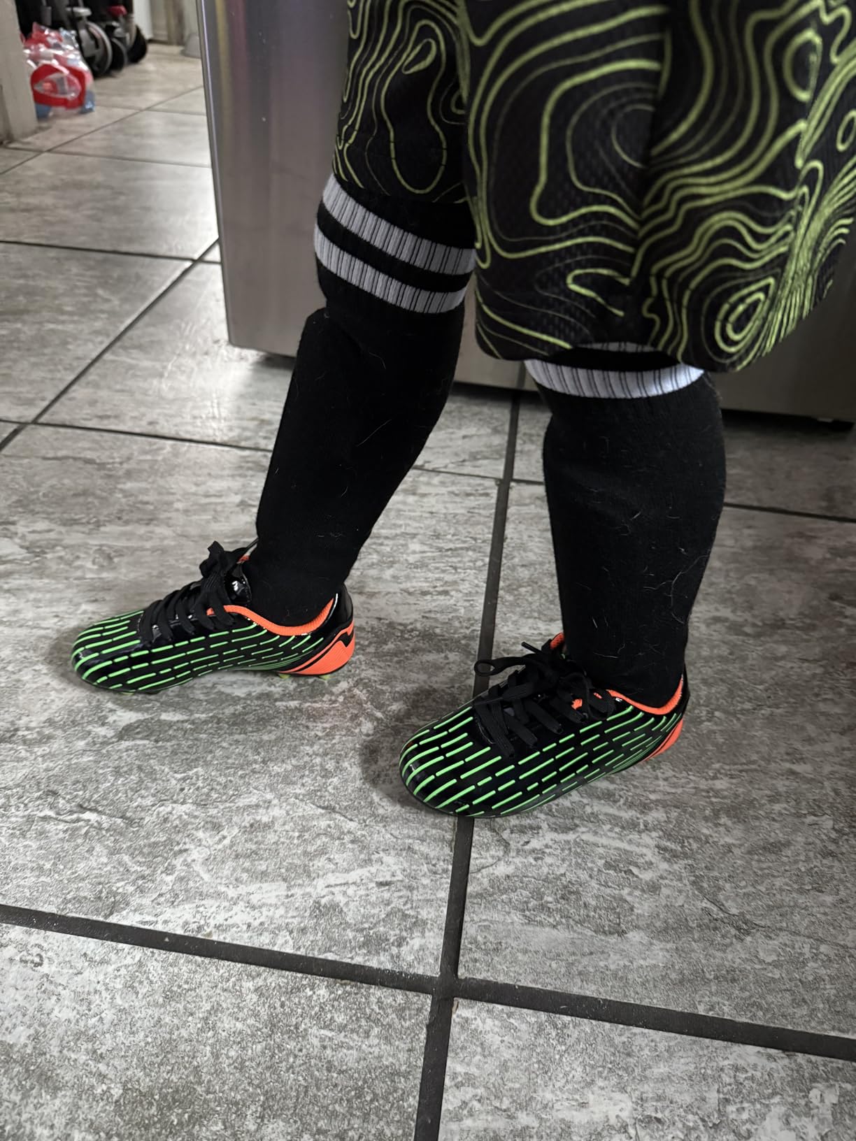 BomKinta soccer cleats showing synthetic upper construction and lace-up design