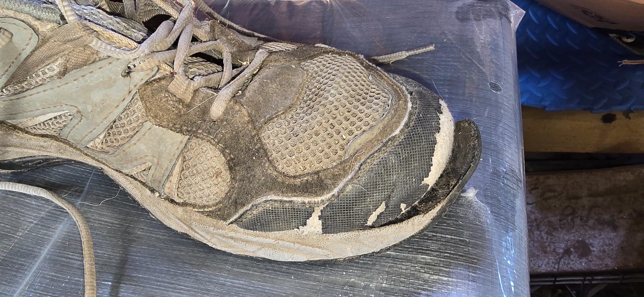 Detailed view of Camel Crown hiking shoe construction showing leather upper and aggressive tread pattern