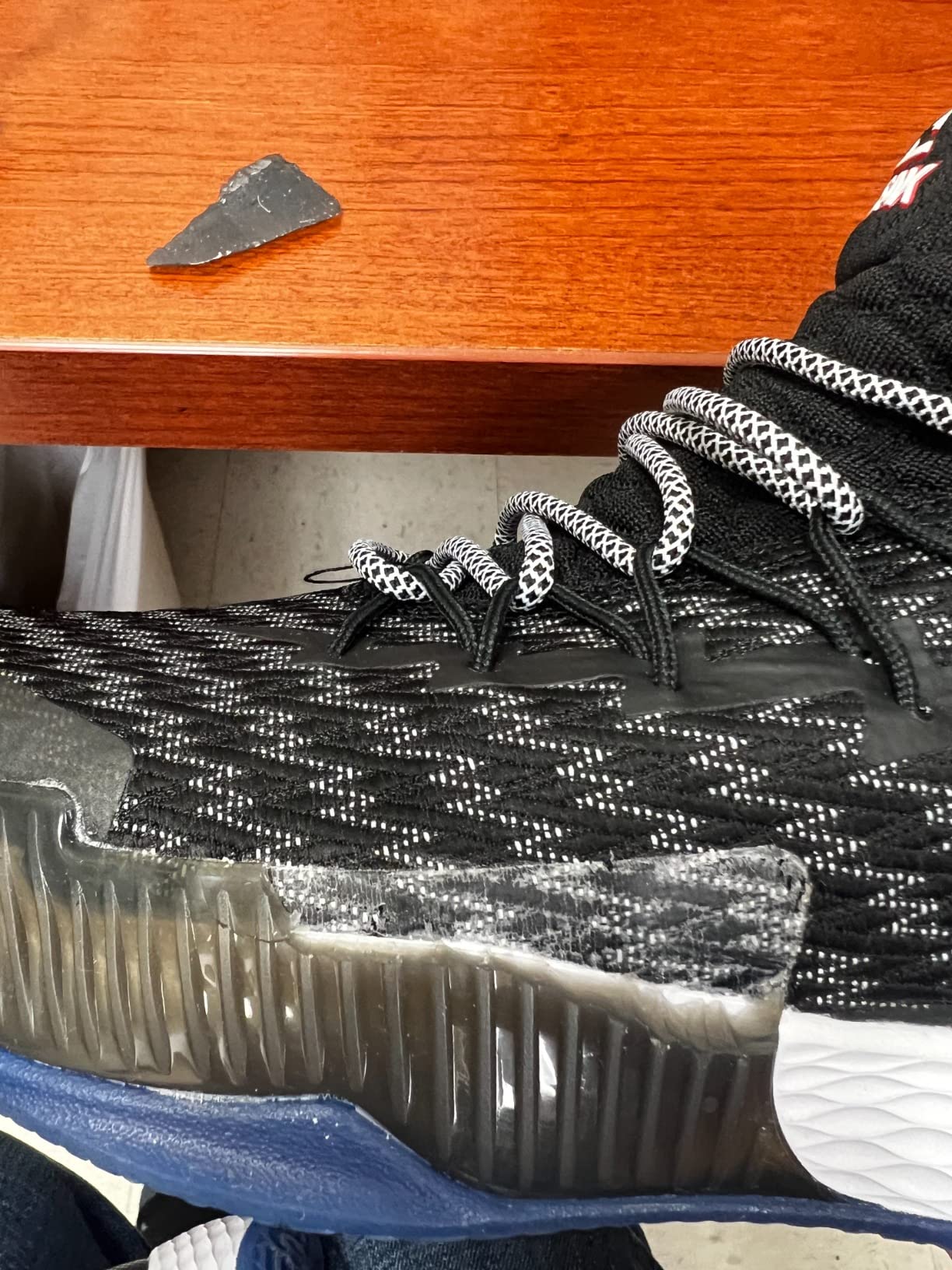 PEAK basketball shoe durability failure showing rubber separation from upper material