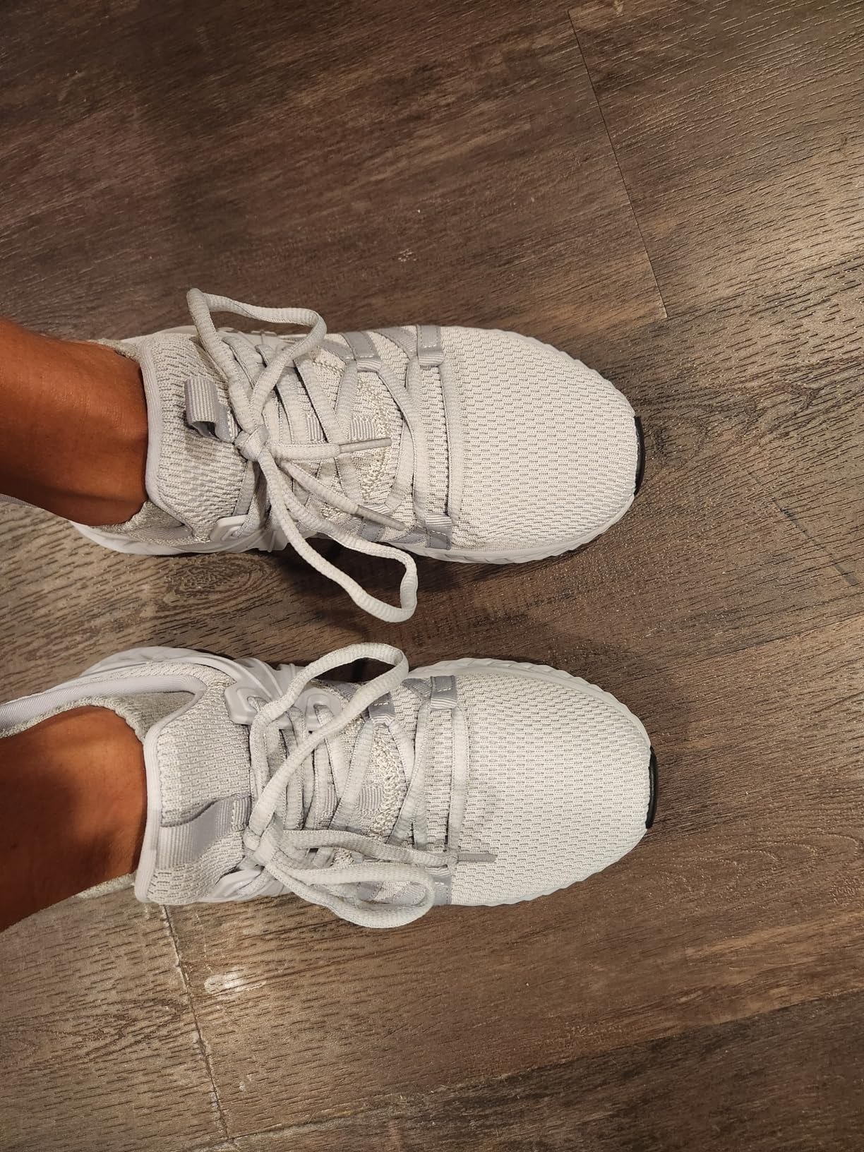 Bottom sole view of Abboos sneakers showing rubber tread pattern and anti-slip design