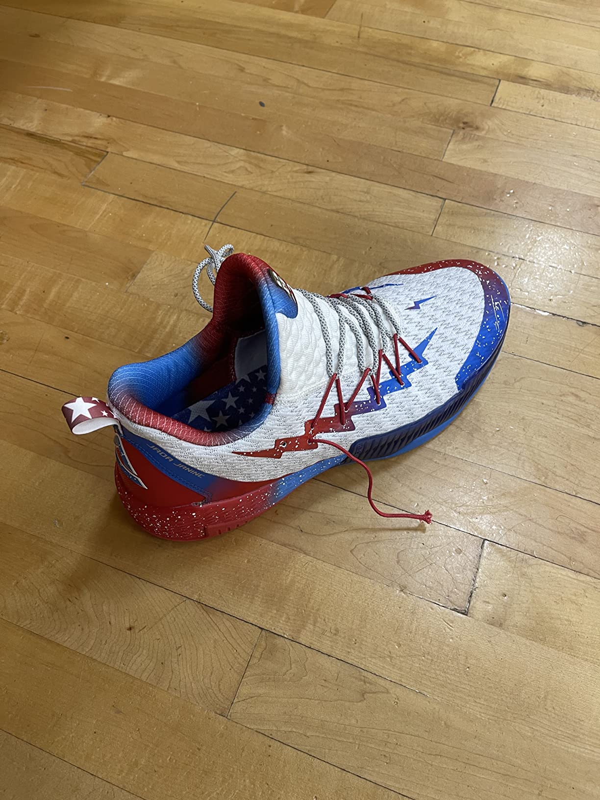 Basketball shoe component failure showing broken lace anchor and compromised structural integrity