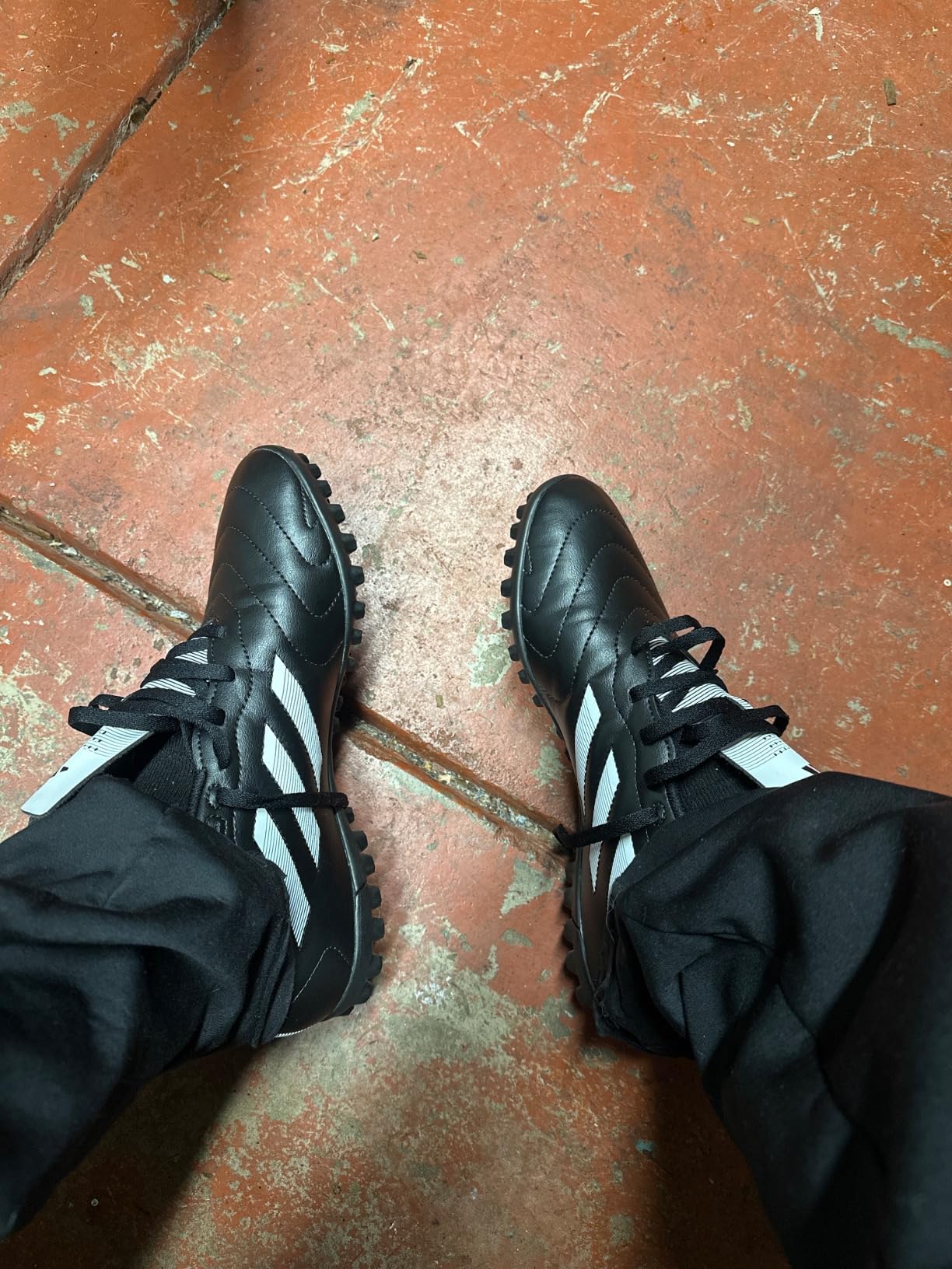 Worn adidas Goletto VIII shoes after several weeks of use showing durability and wear patterns