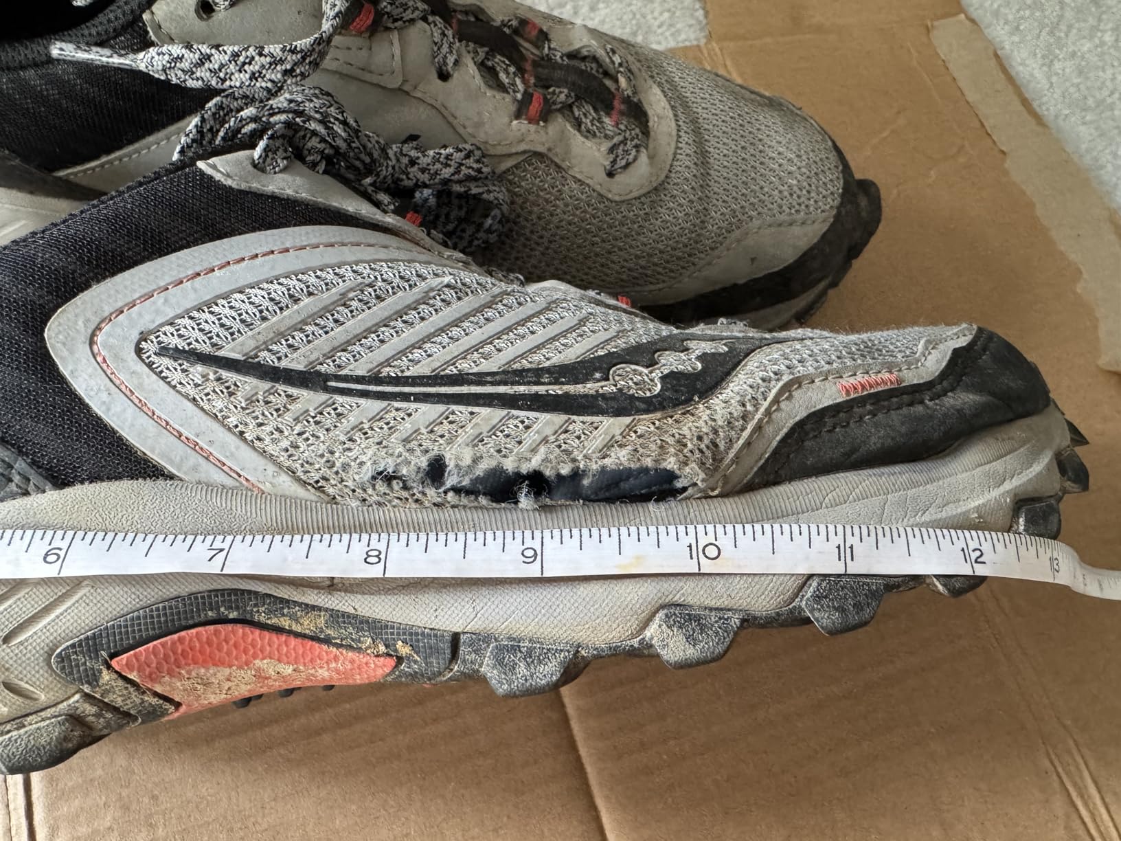 Saucony TR15 showing extensive sole and upper separation after moderate trail use