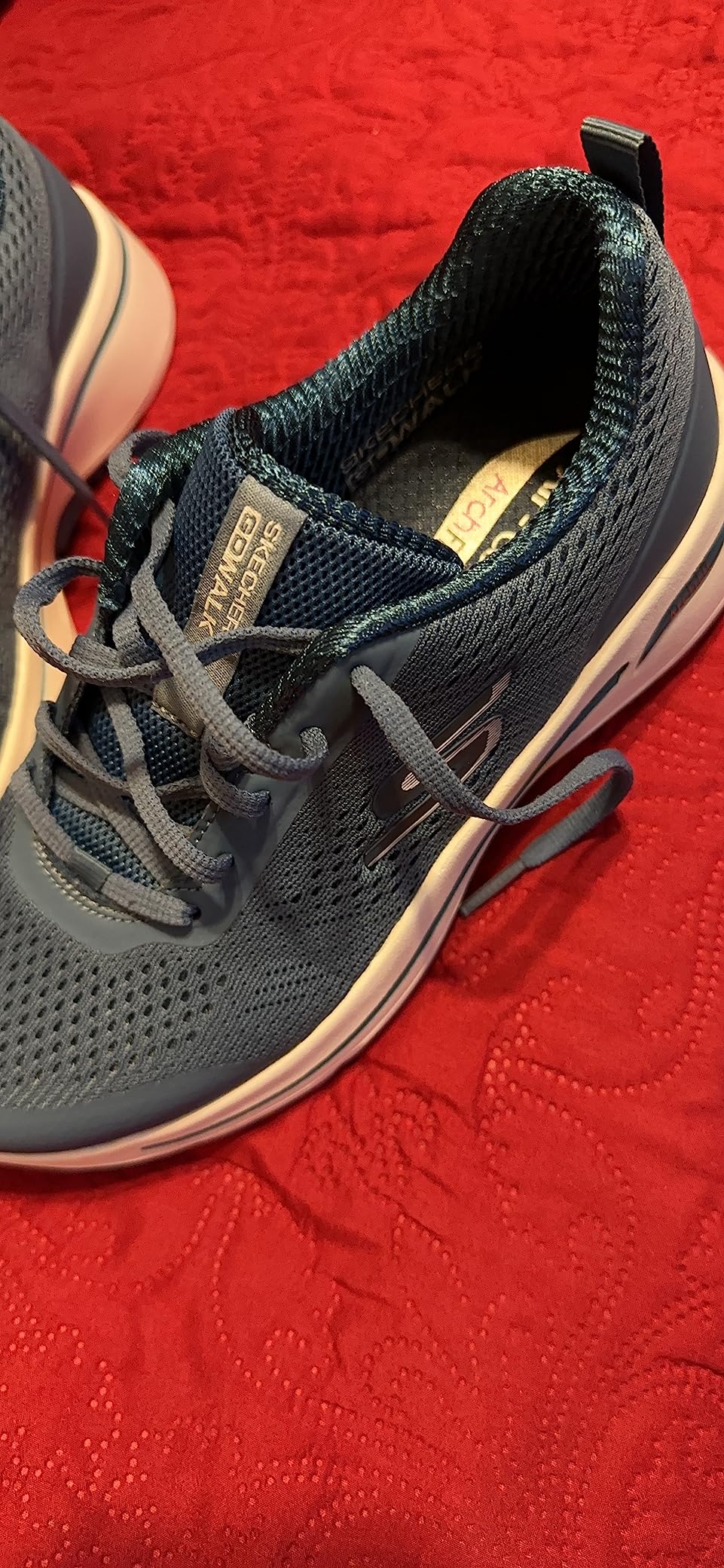 Skechers Go Walk Arch Fit in action showing flexibility and support during walking motion