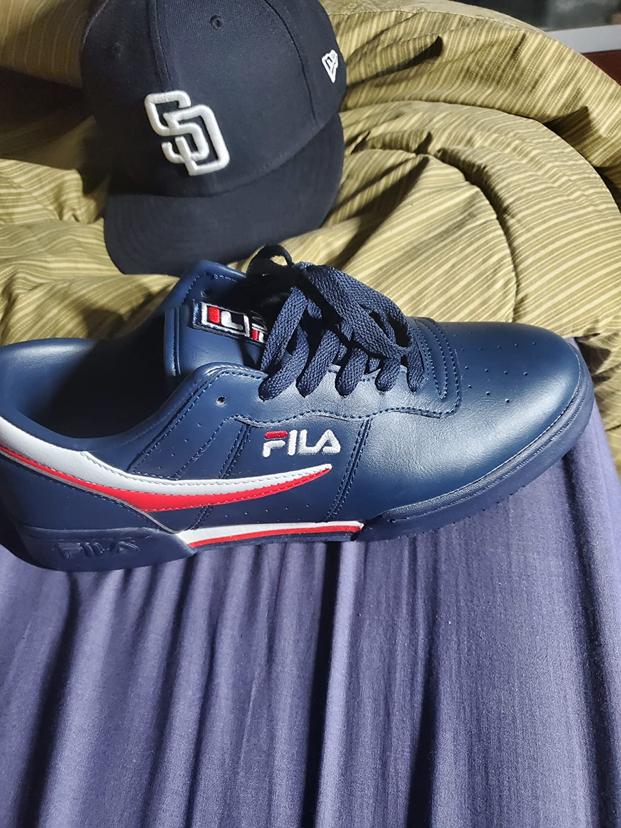 Fila Original Fitness sneaker action shot showing classic styling in urban setting