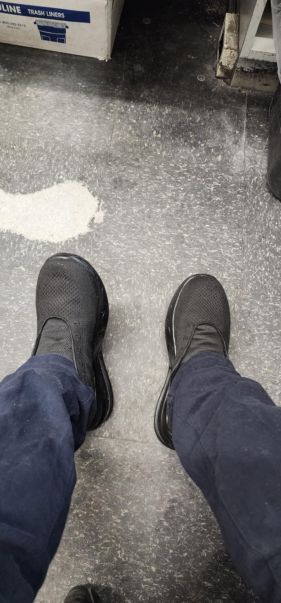 Close-up view of LARNMERN work shoes showing mesh upper material and lacing system
