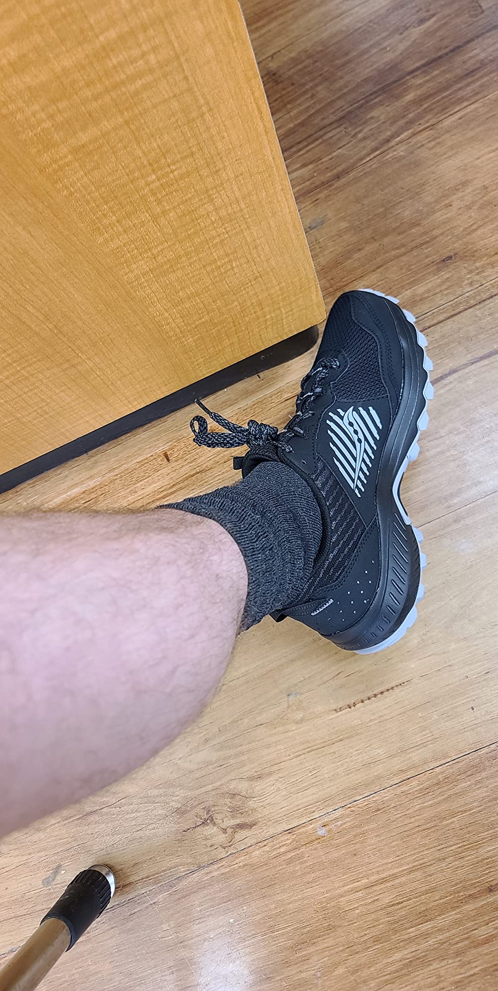 Saucony TR15 trail running shoes on rocky trail terrain showing real-world usage scenario
