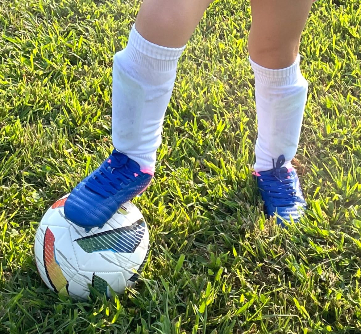 DREAM PAIRS cleats in action showing performance on grass field