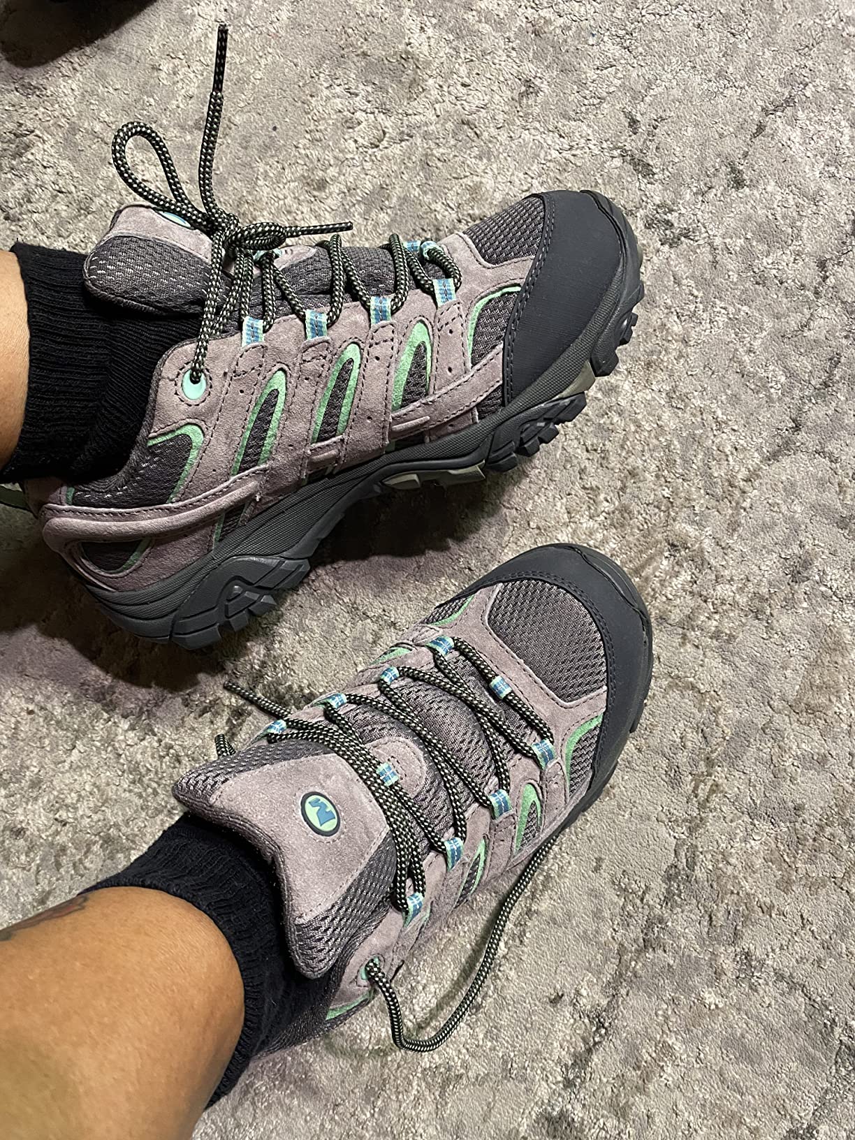 Merrell Moab 2 in gray turquoise colorway showing comfortable fit and design