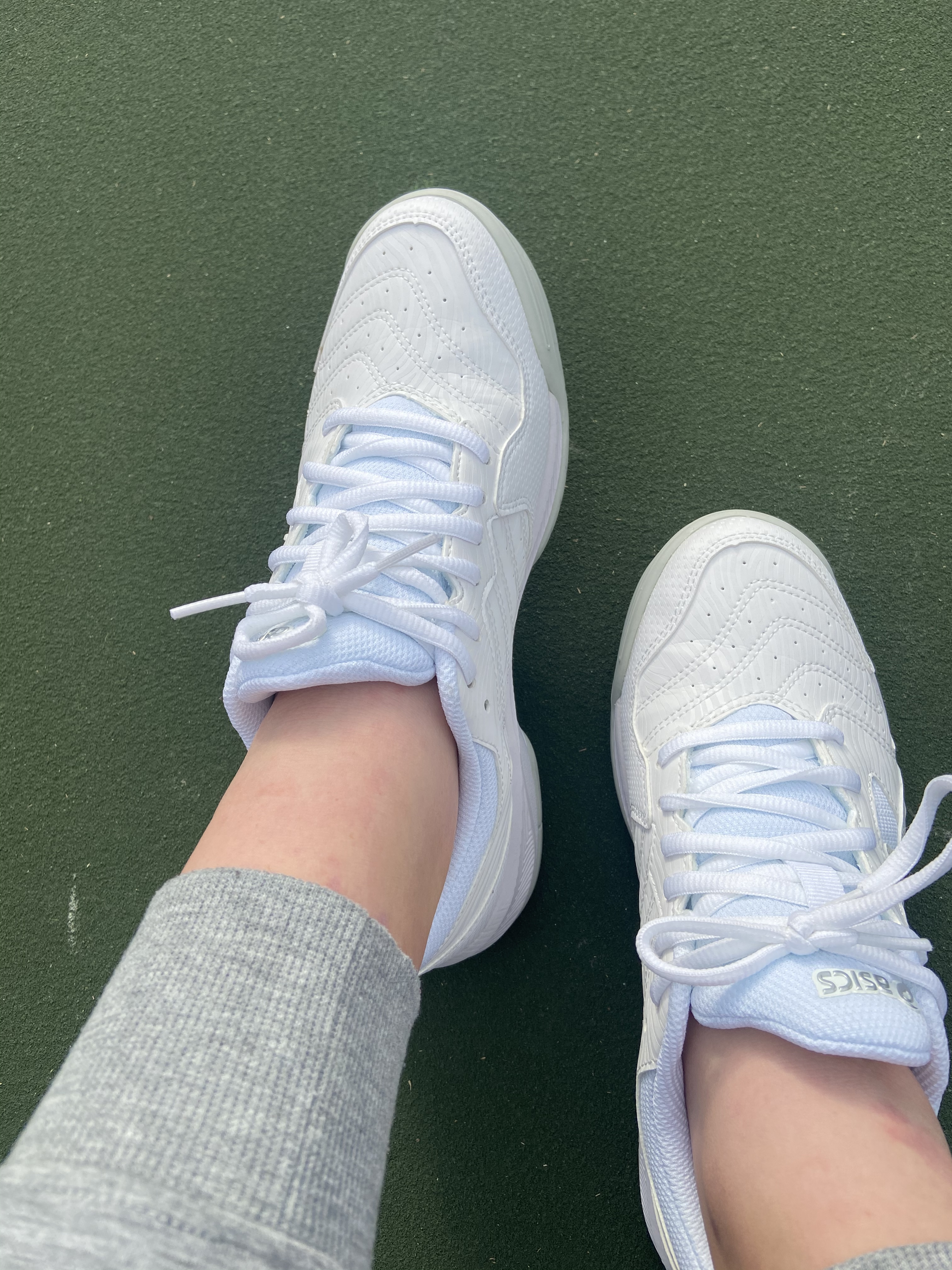 ASICS Women's Gel-Dedicate 6 tennis shoes grey pink colorway showing synthetic leather upper and gel cushioning system