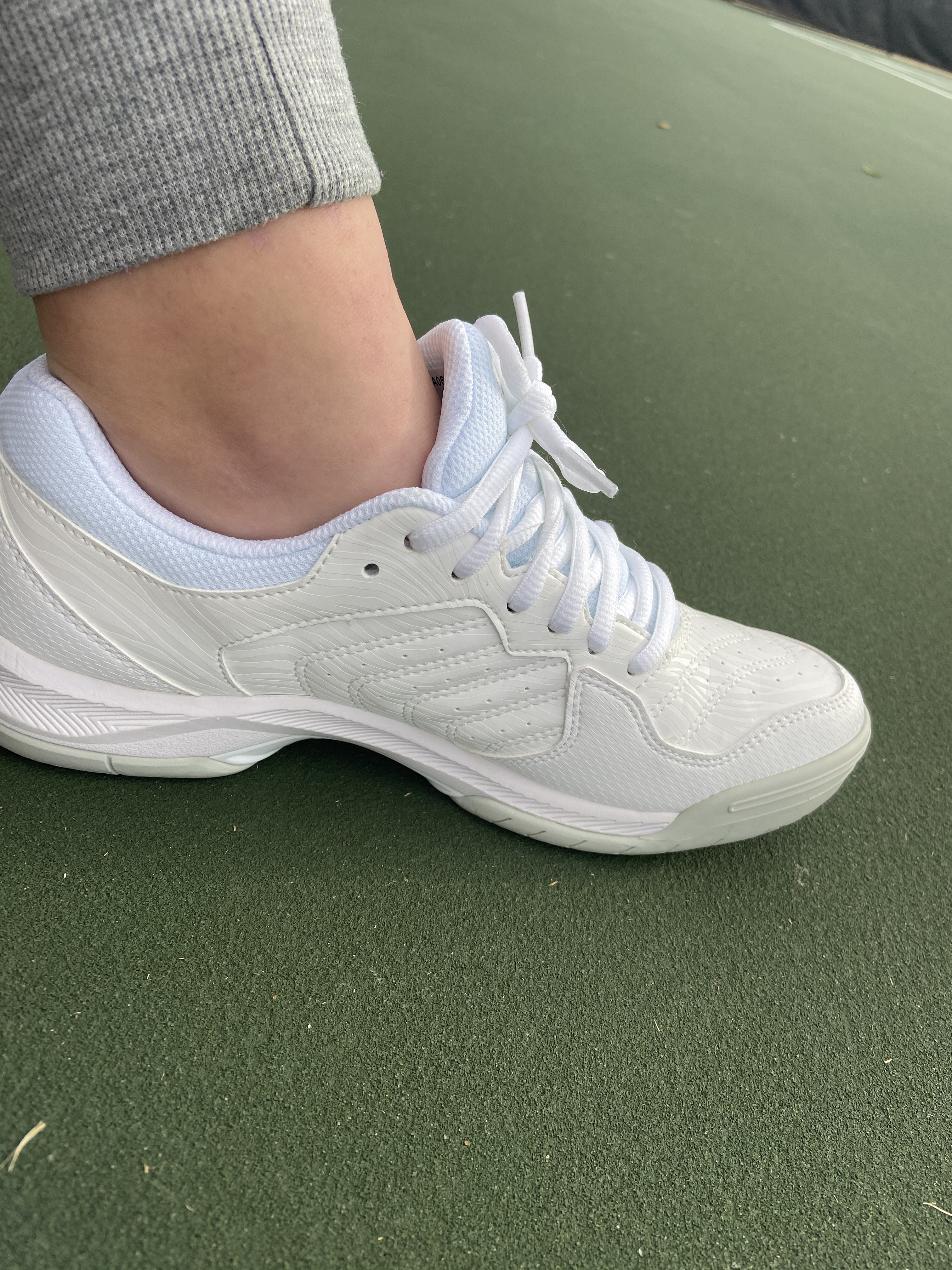 Close-up view of ASICS Gel-Dedicate 6 showing synthetic upper construction and lace-up closure system
