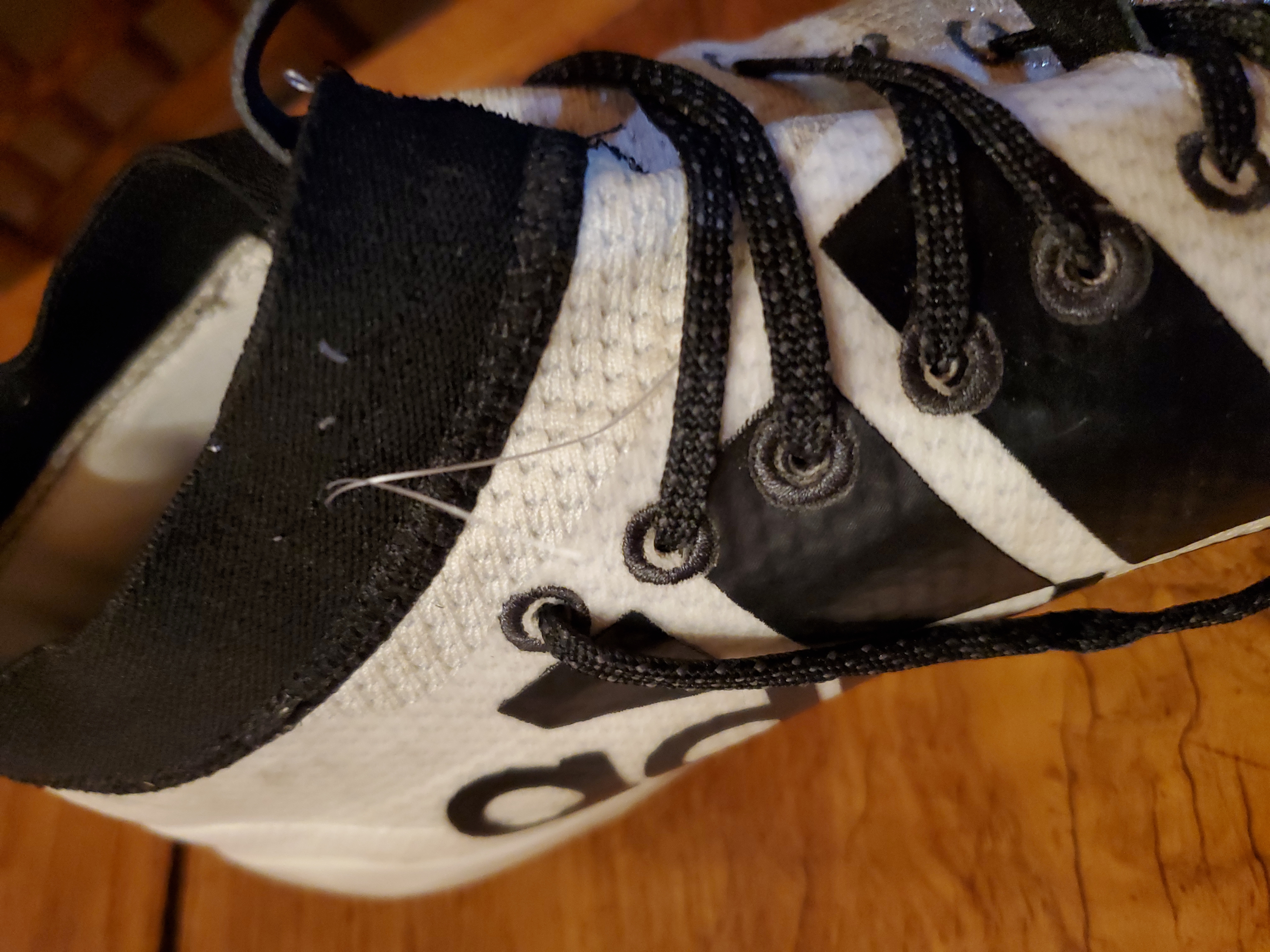 Football players wearing Adidas Adizero Scorch cleats showing real world usage scenarios