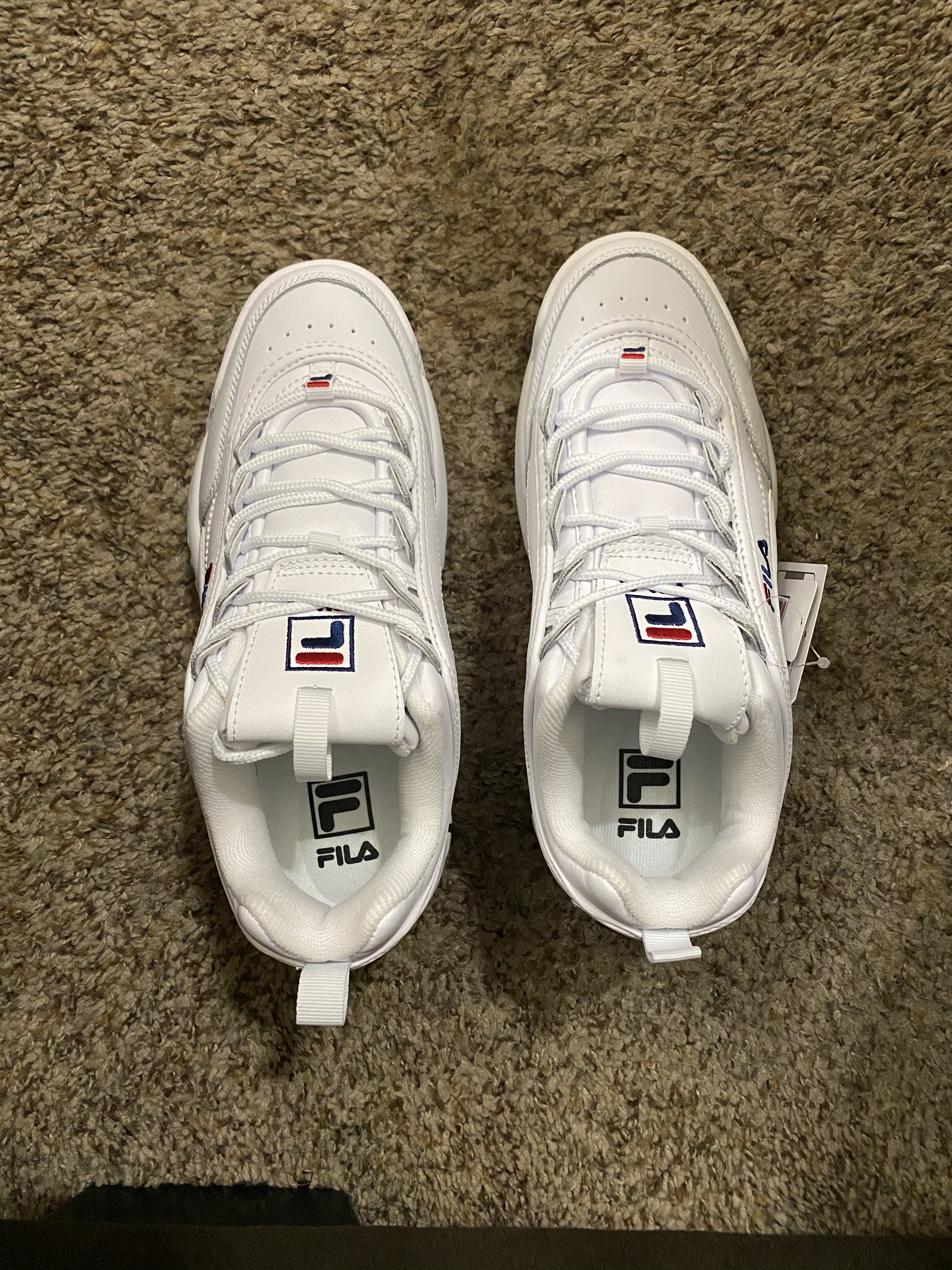 Comparison shot showing Fila Disruptor II construction quality and materials