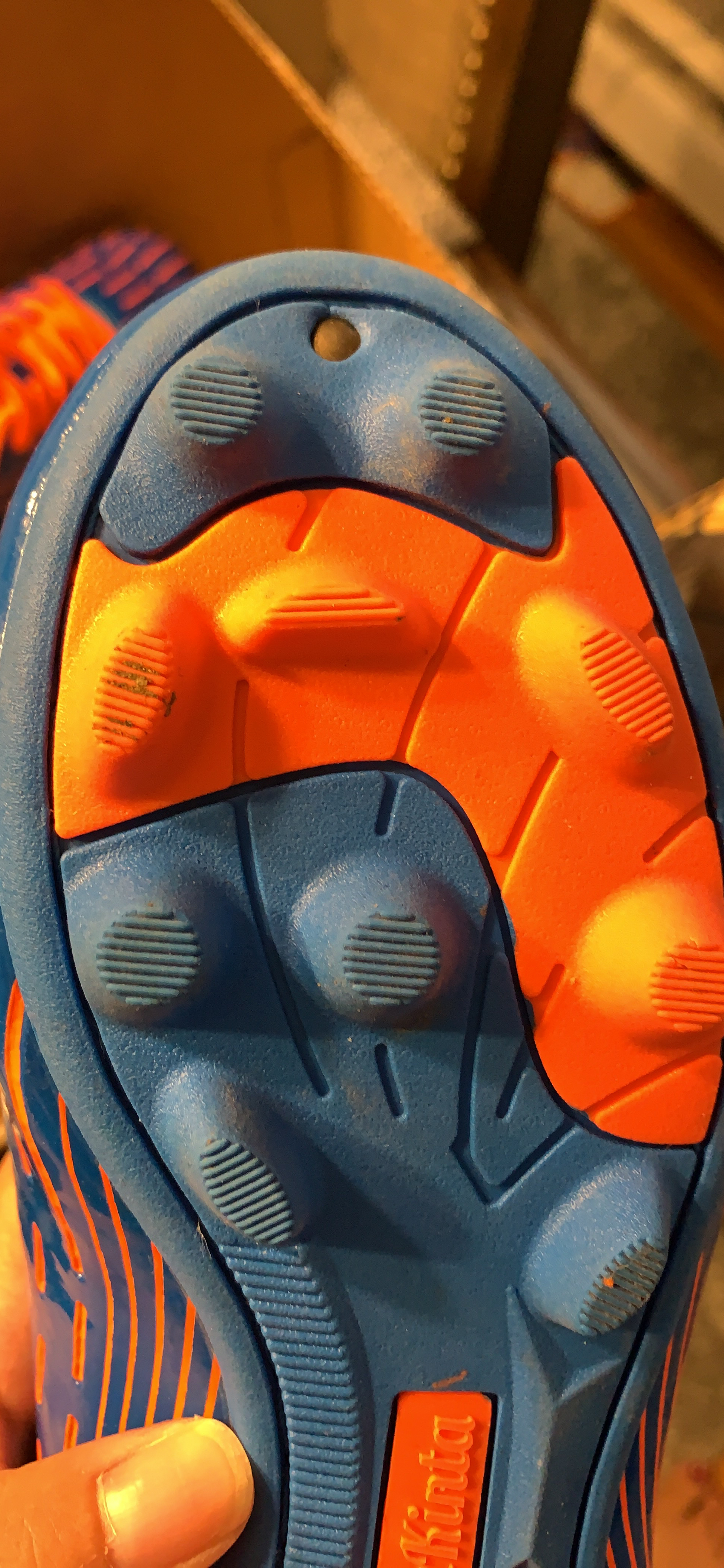 Final product shot of BomKinta kids soccer cleats showing overall design and build quality
