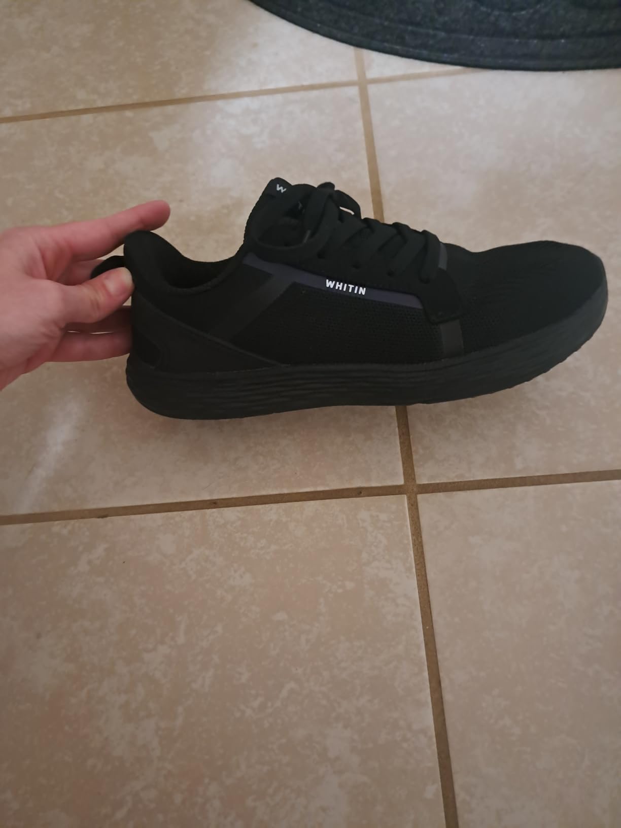 WHITIN shoe lacing system and tongue construction detail