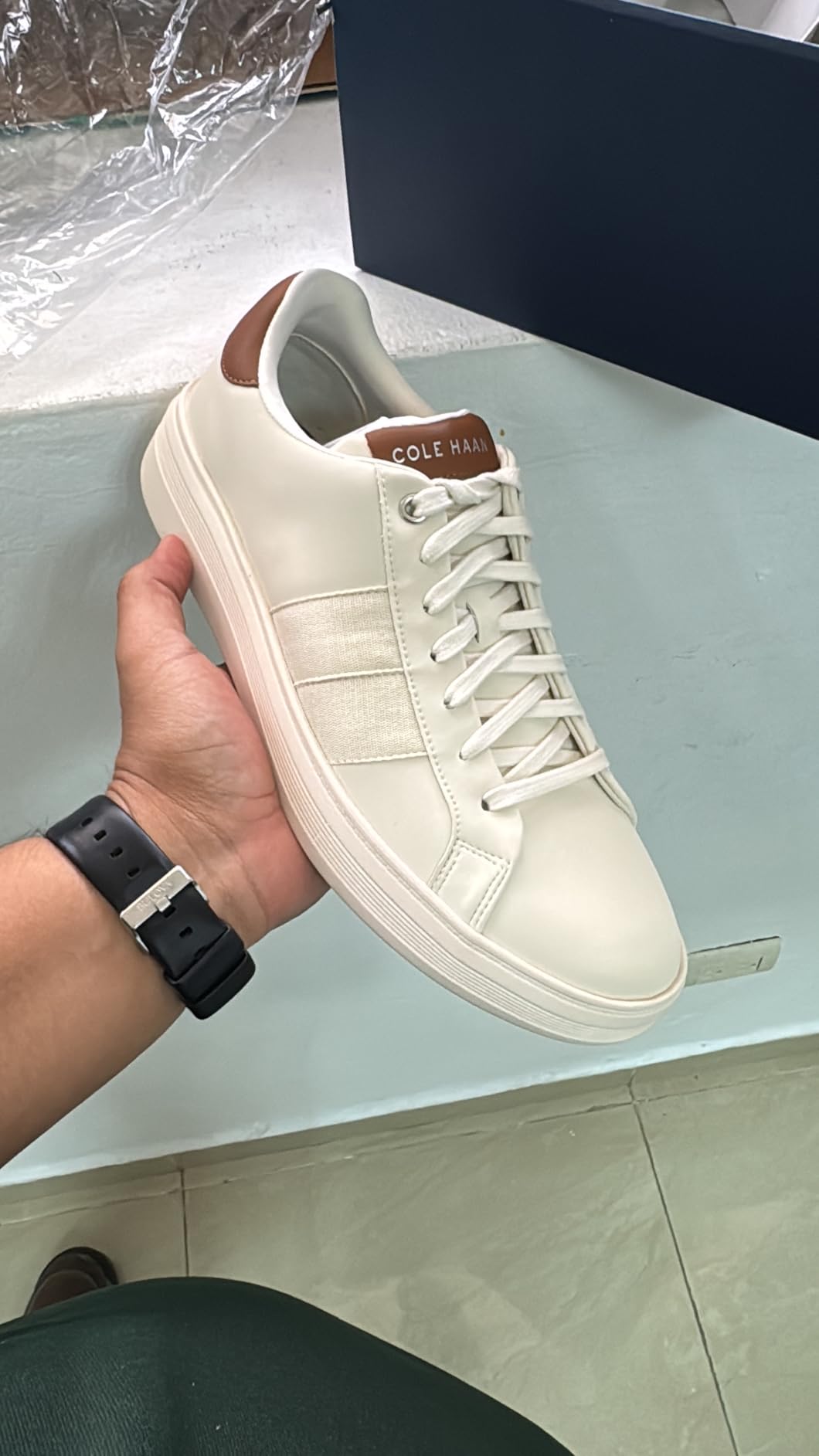 Cole Haan sneaker on foot showing fit and profile from multiple angles