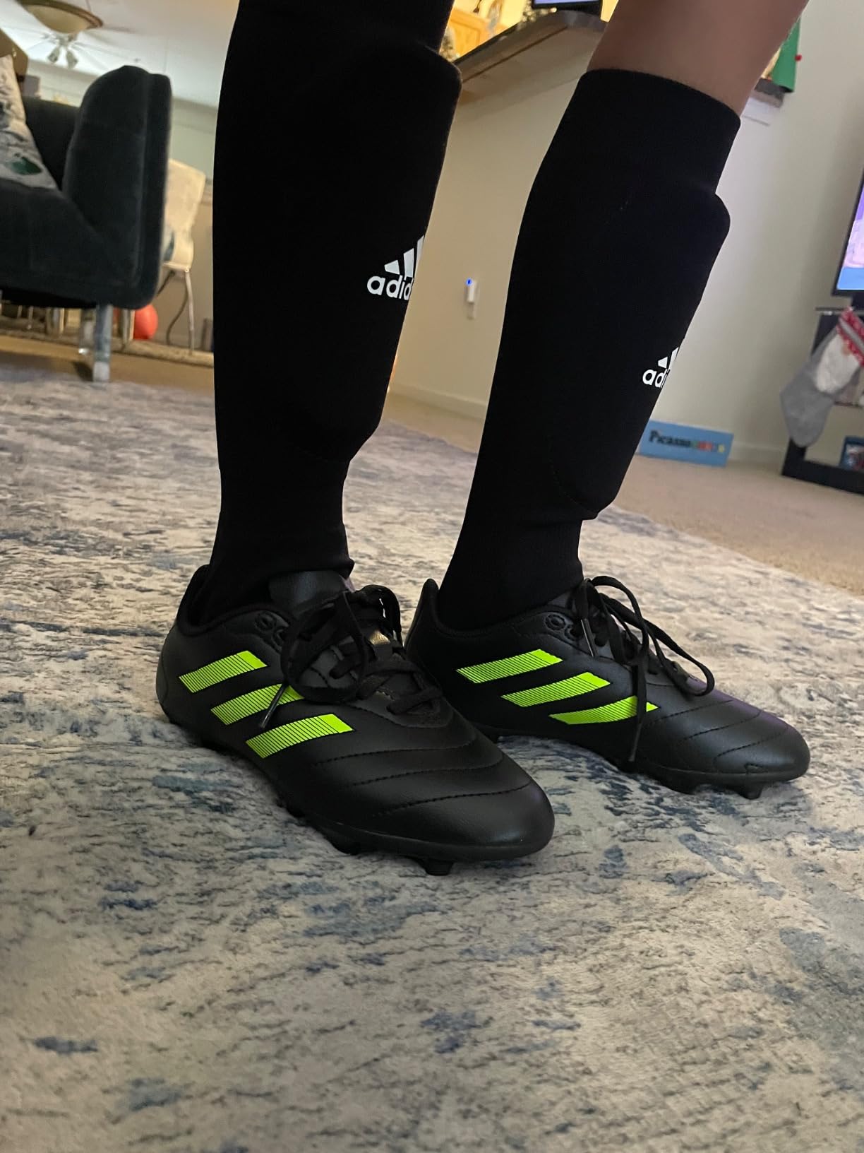 Close-up view of Adidas Goletto VII synthetic upper material and construction details