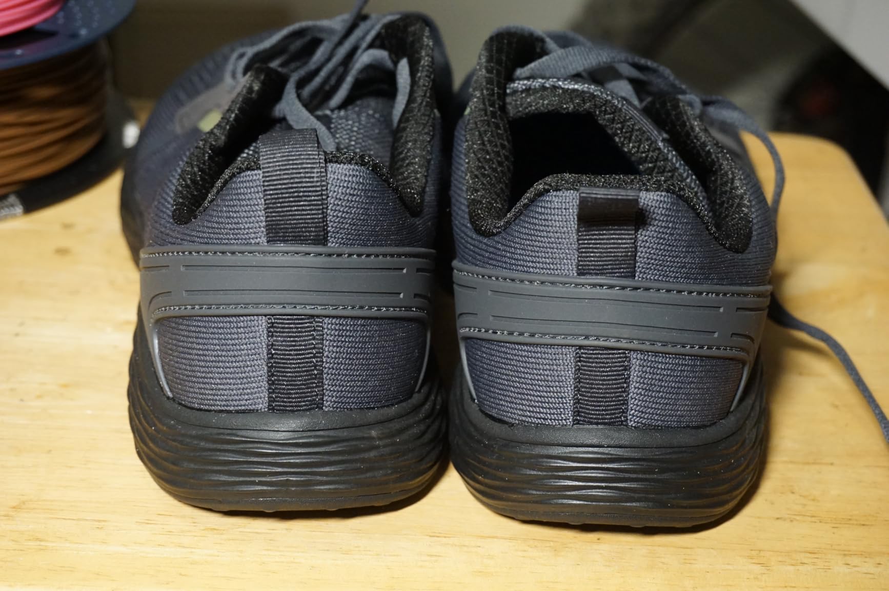 WHITIN shoe side profile showing knit upper construction and zero drop sole design