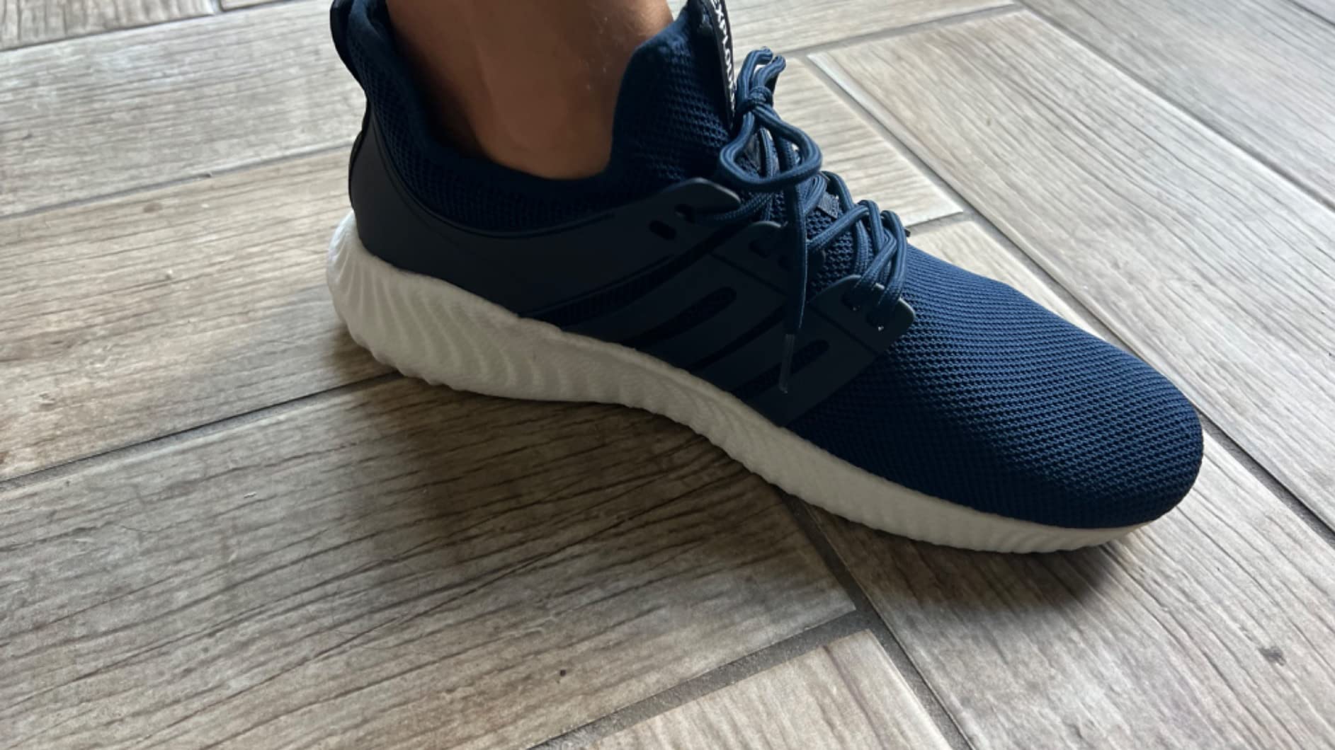 AKK sneakers navy blue colorway on feet showing fit and style