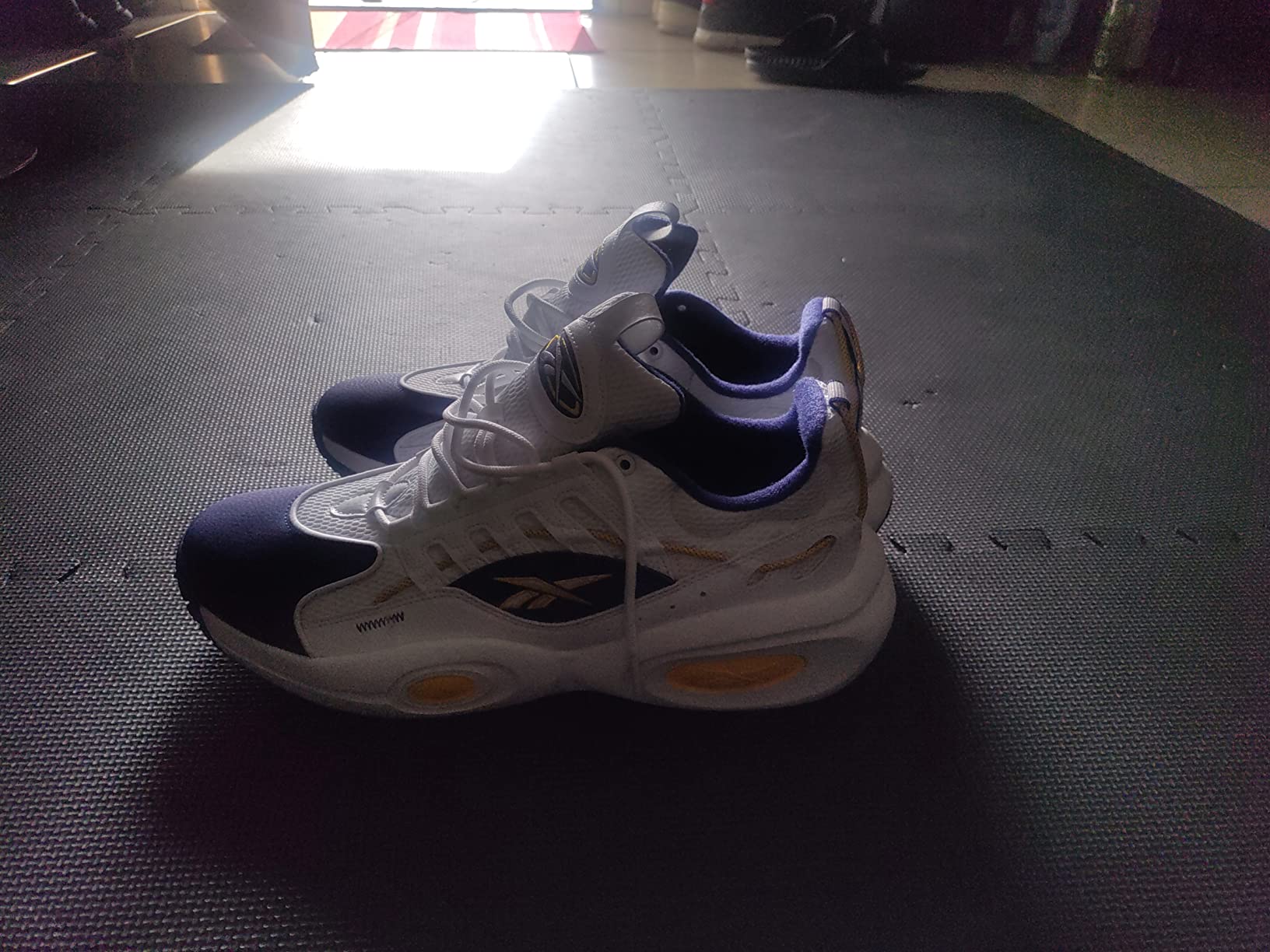 Multiple colorways of Reebok Solution Mid basketball shoes showing style variety