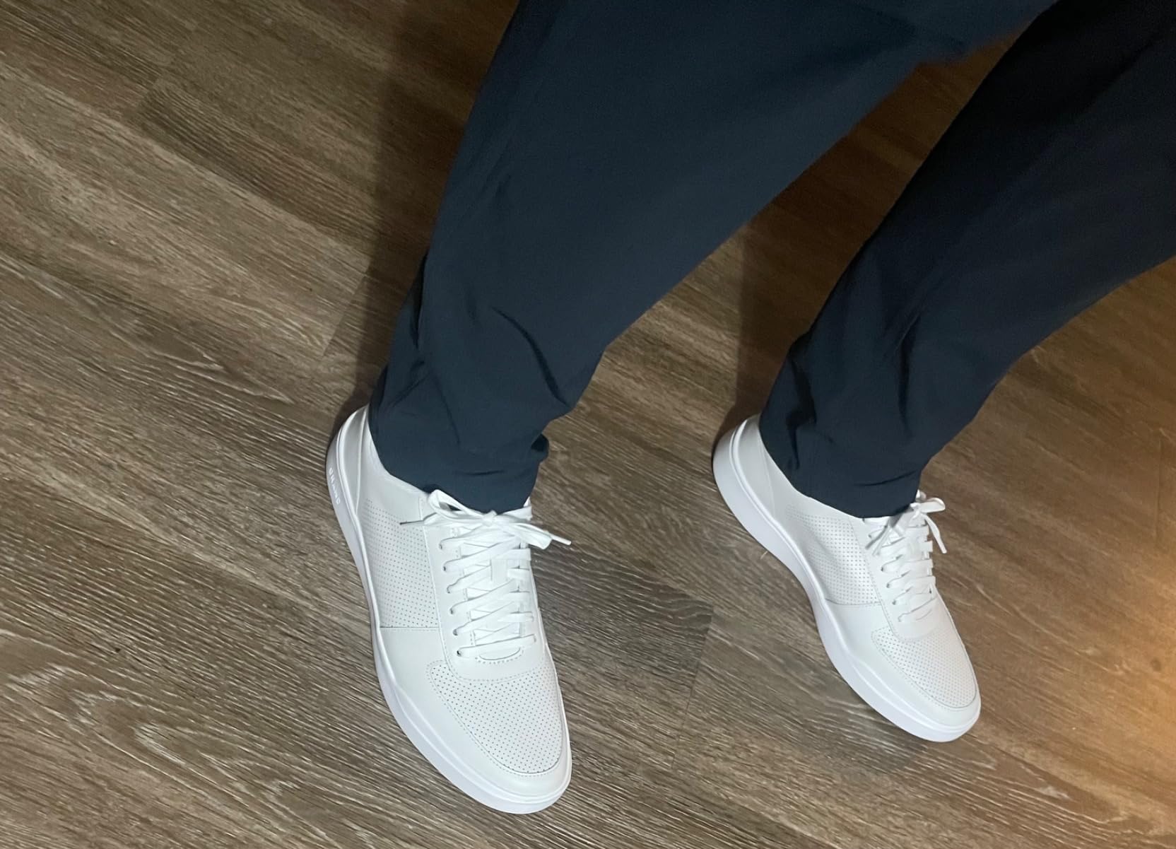 Cole Haan sneakers travel versatility showing multiple outfit combinations and settings