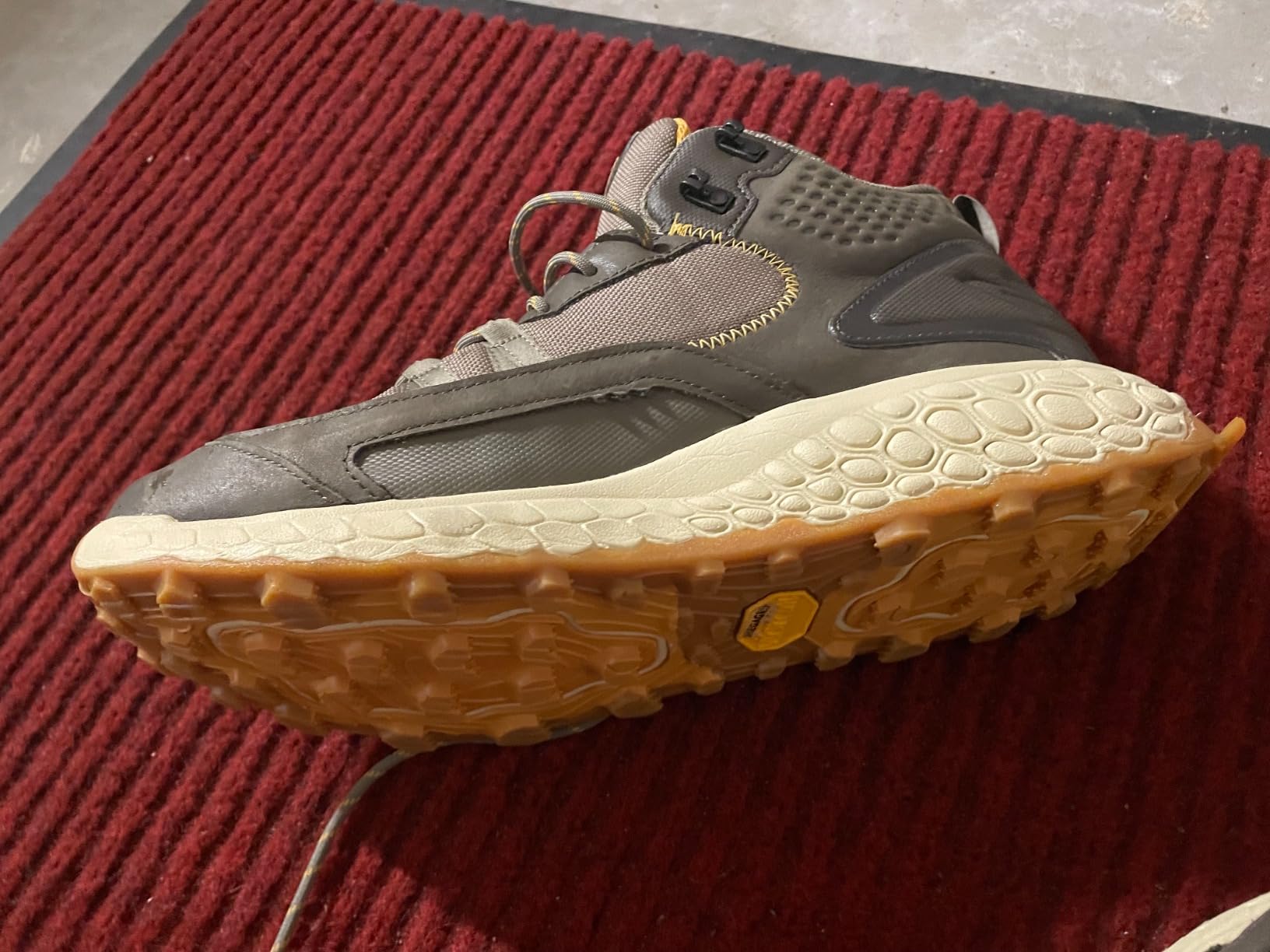 Close-up of stitching separation issue at toe area showing quality control concerns