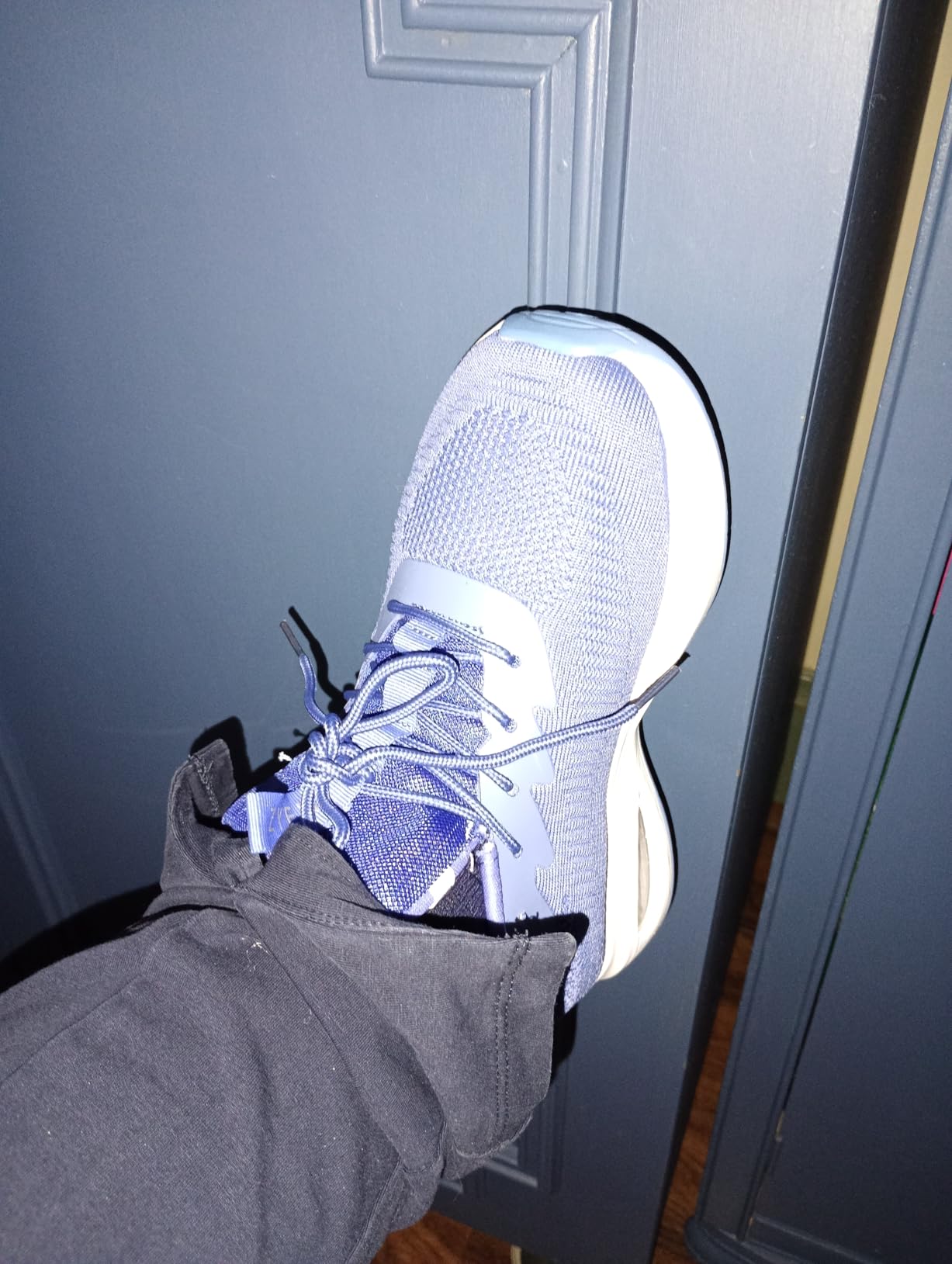 ZYEN blue colorway showing side profile and air cushion heel technology
