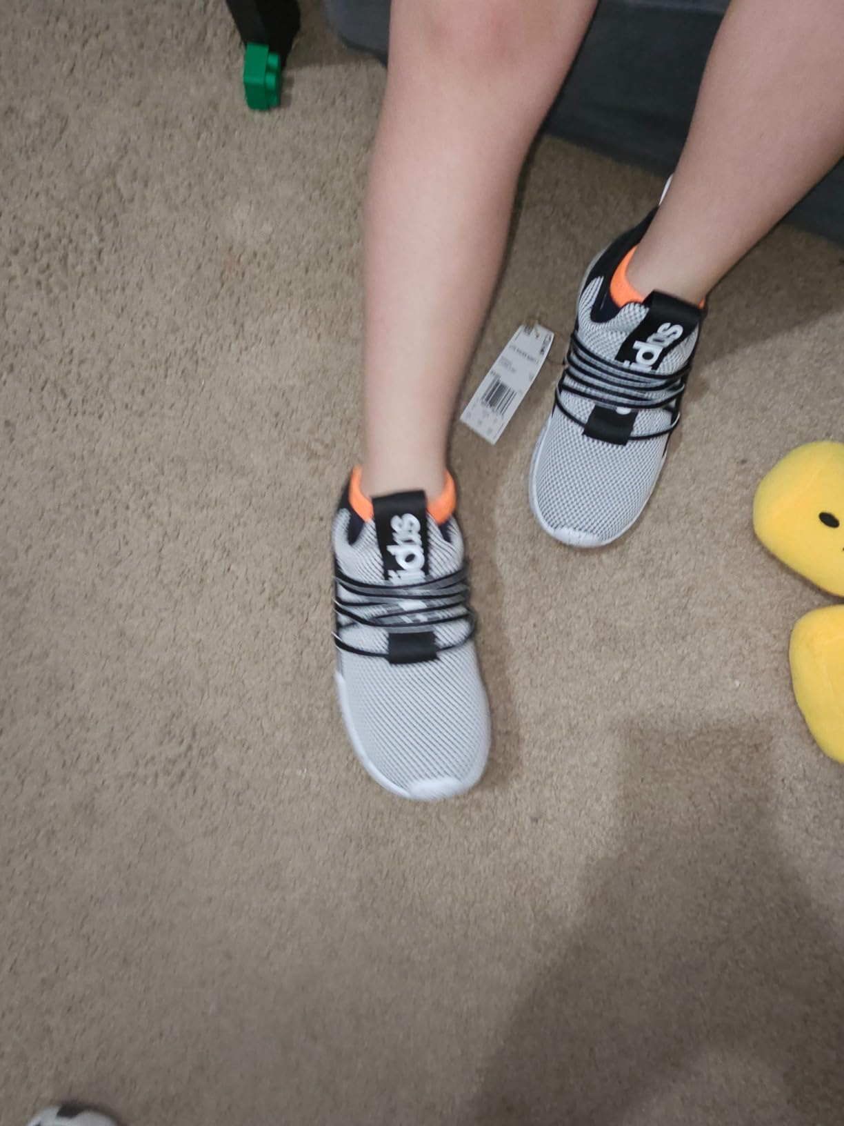 Adidas Lite Racer Adapt 7.0 kids sneakers showing stretchy textile upper and slip-on design
