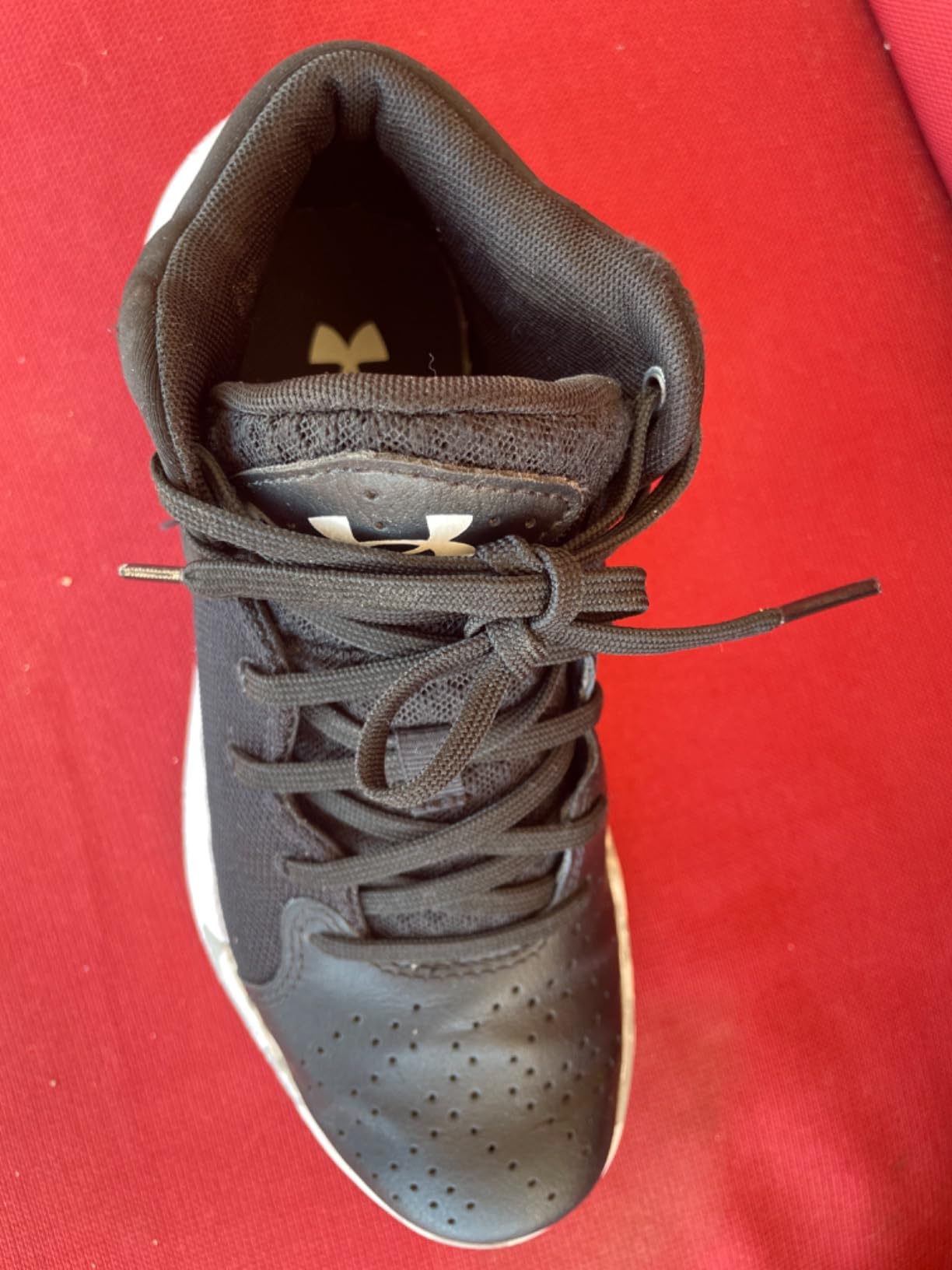 Under Armour Kids basketball shoes action shot showing performance during youth basketball game
